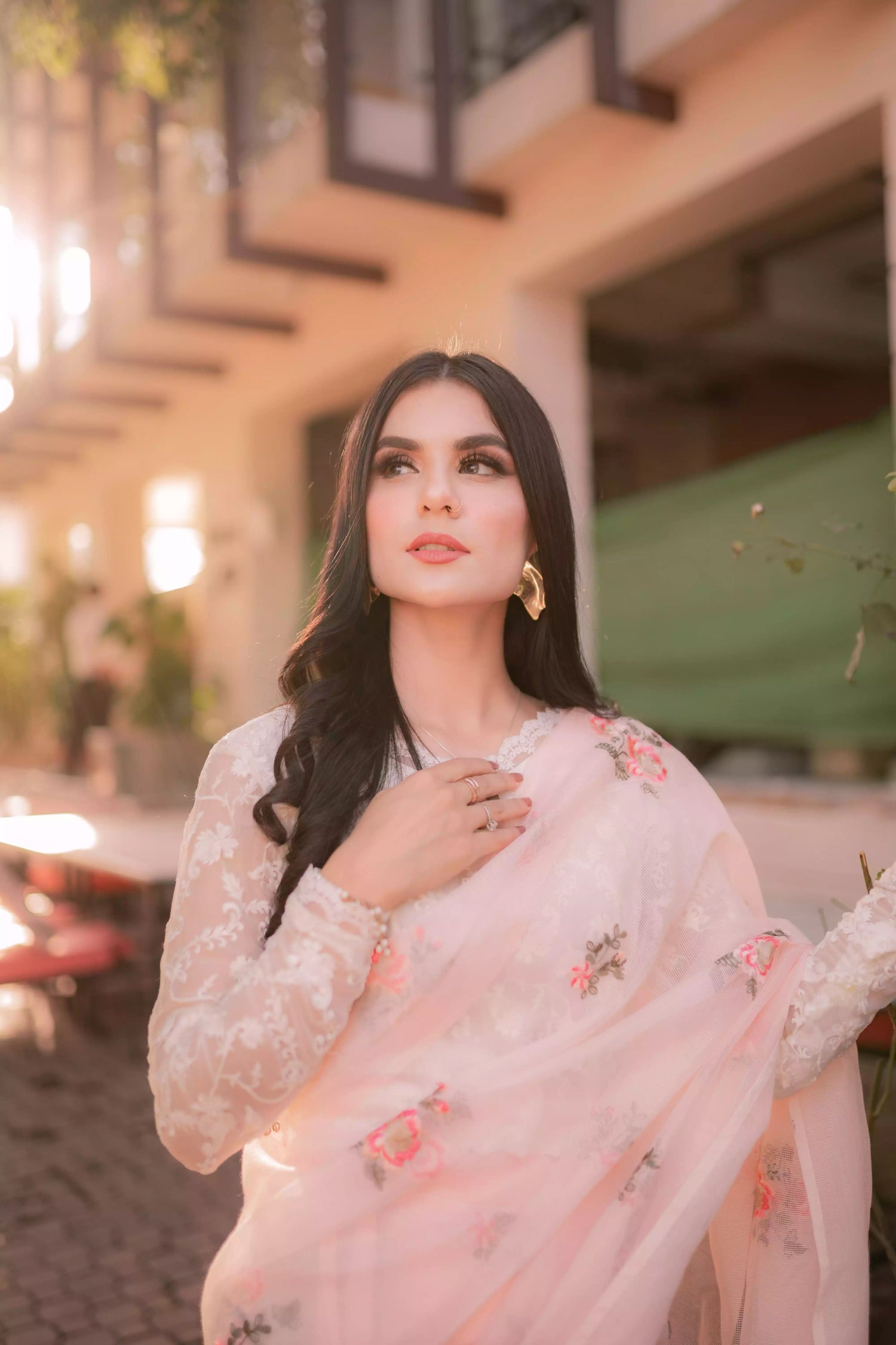 Powder pink embroidered cotton net saree with floral motifs, shown with optional stitched chiffon blouse and matching inner, perfect for weddings and formal occasions.