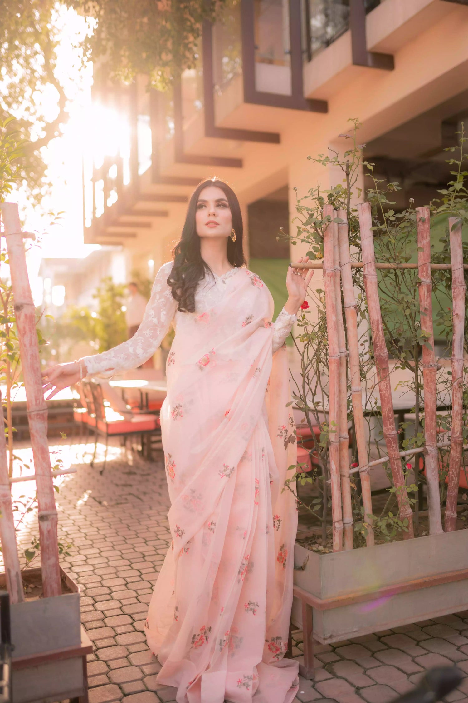 Powder pink embroidered cotton net saree with floral motifs, shown with optional stitched chiffon blouse and matching inner, perfect for weddings and formal occasions.