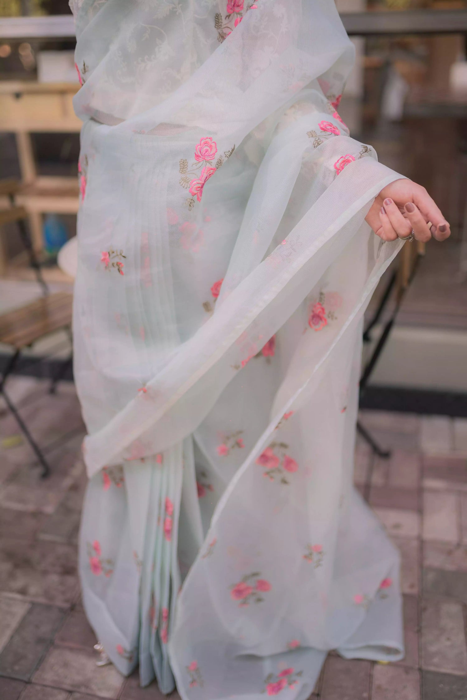 The serene ice blue saree with elegant drape with delicate intricate floral details.