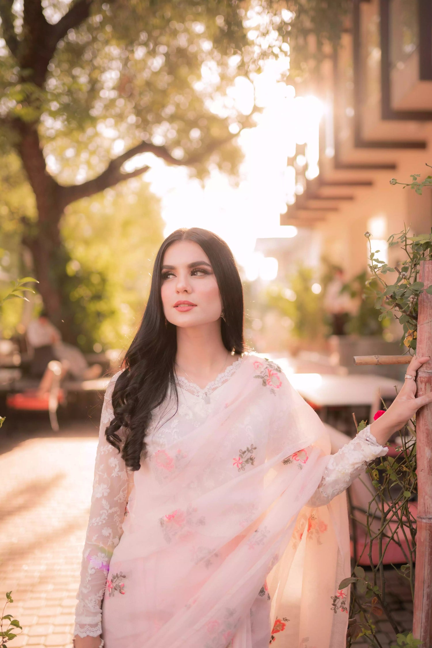 Powder pink embroidered cotton net saree with floral motifs, shown with optional stitched chiffon blouse and matching inner, perfect for weddings and formal occasions.