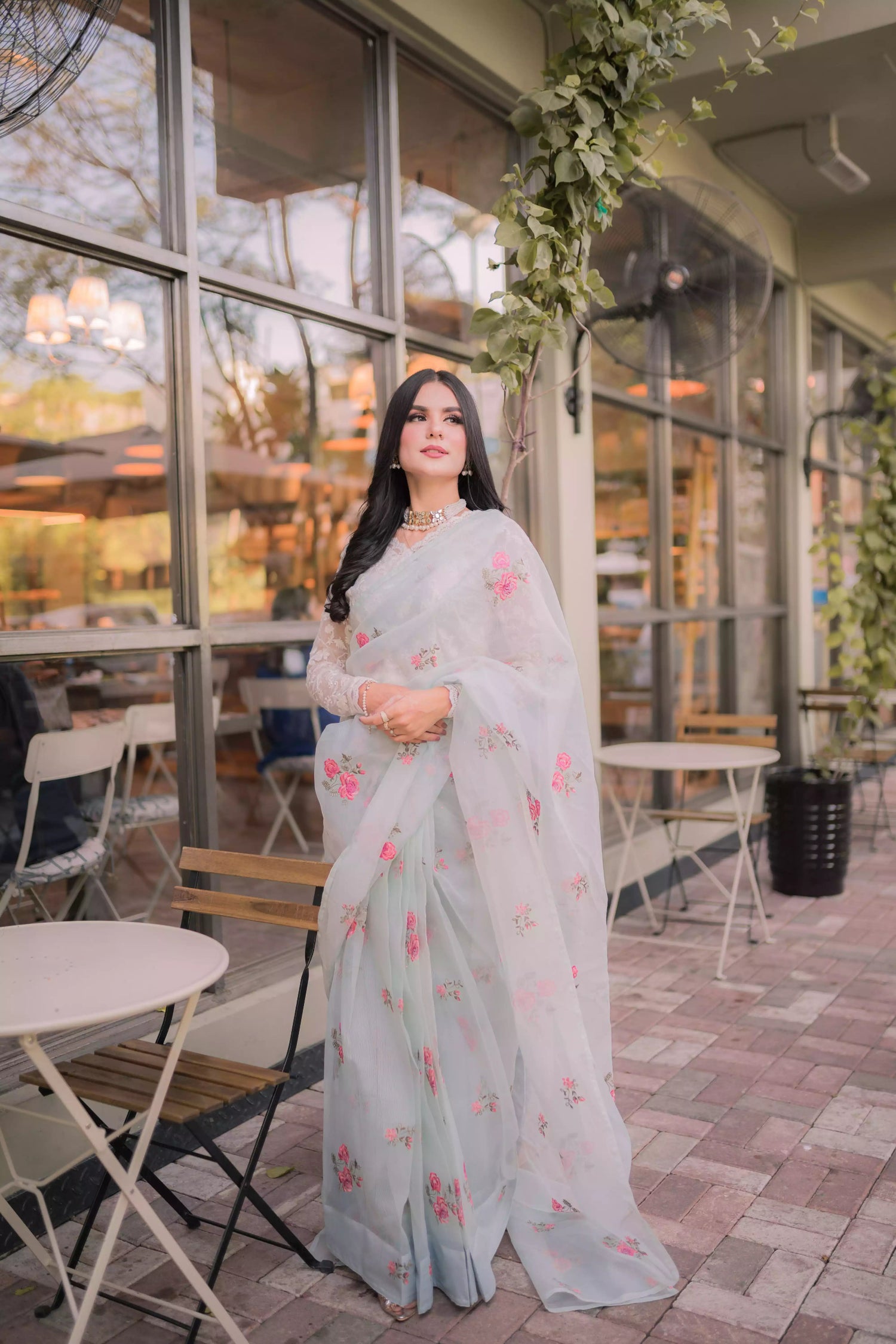 The serene ice blue saree with elegant drape with delicate intricate floral details.
