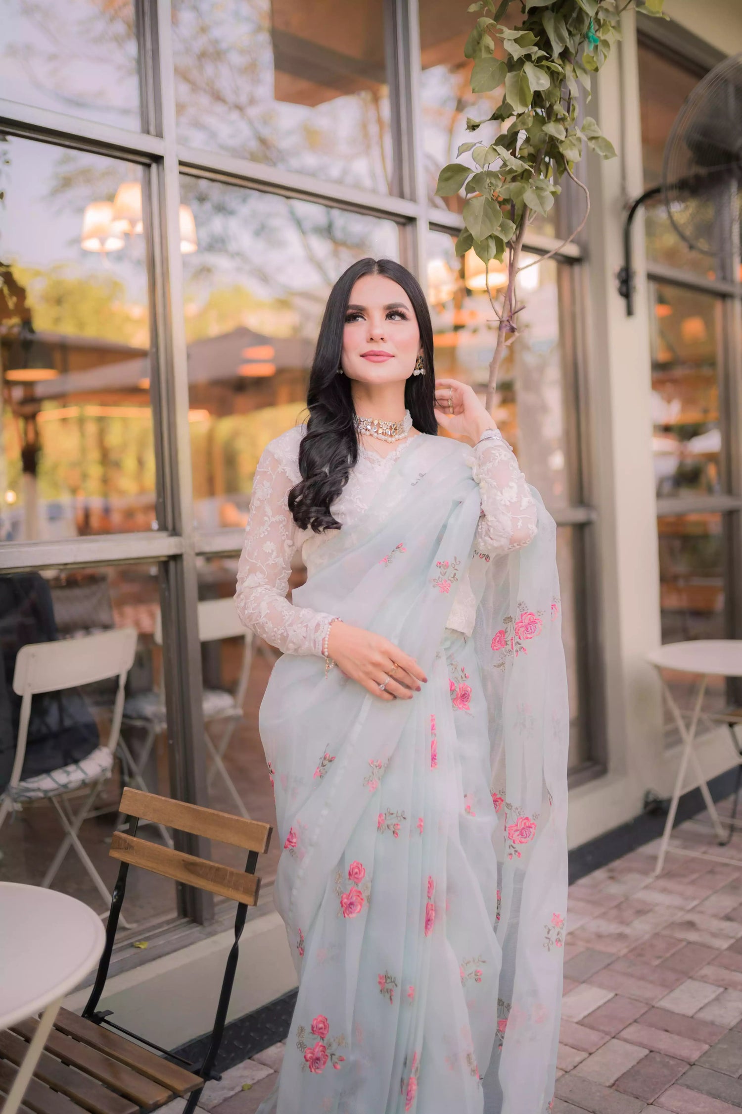 The serene ice blue saree with elegant drape with delicate intricate floral details.
