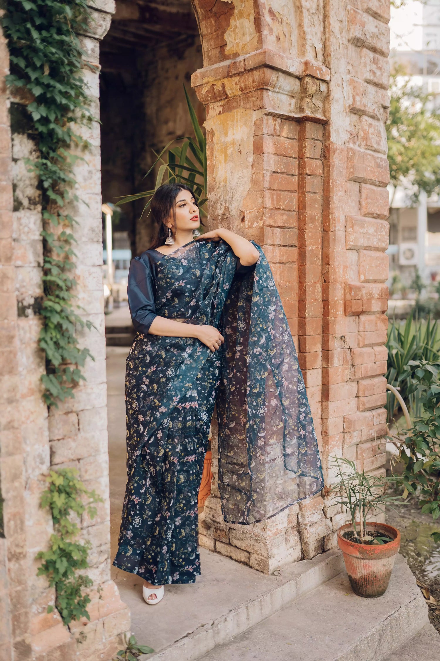 Floral navy blue saree styled gracefully with ethnic elegance.