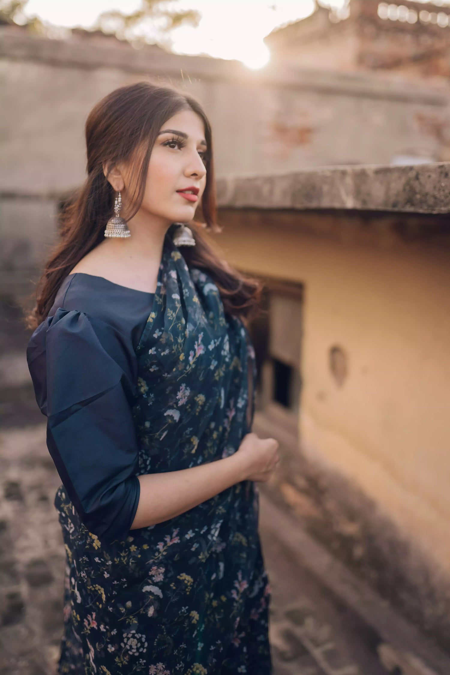 Floral navy blue saree styled gracefully with ethnic elegance.