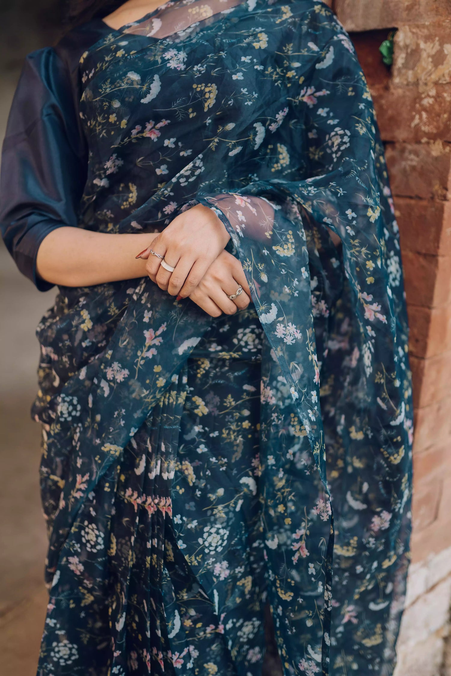 Floral navy blue saree styled gracefully with ethnic elegance.