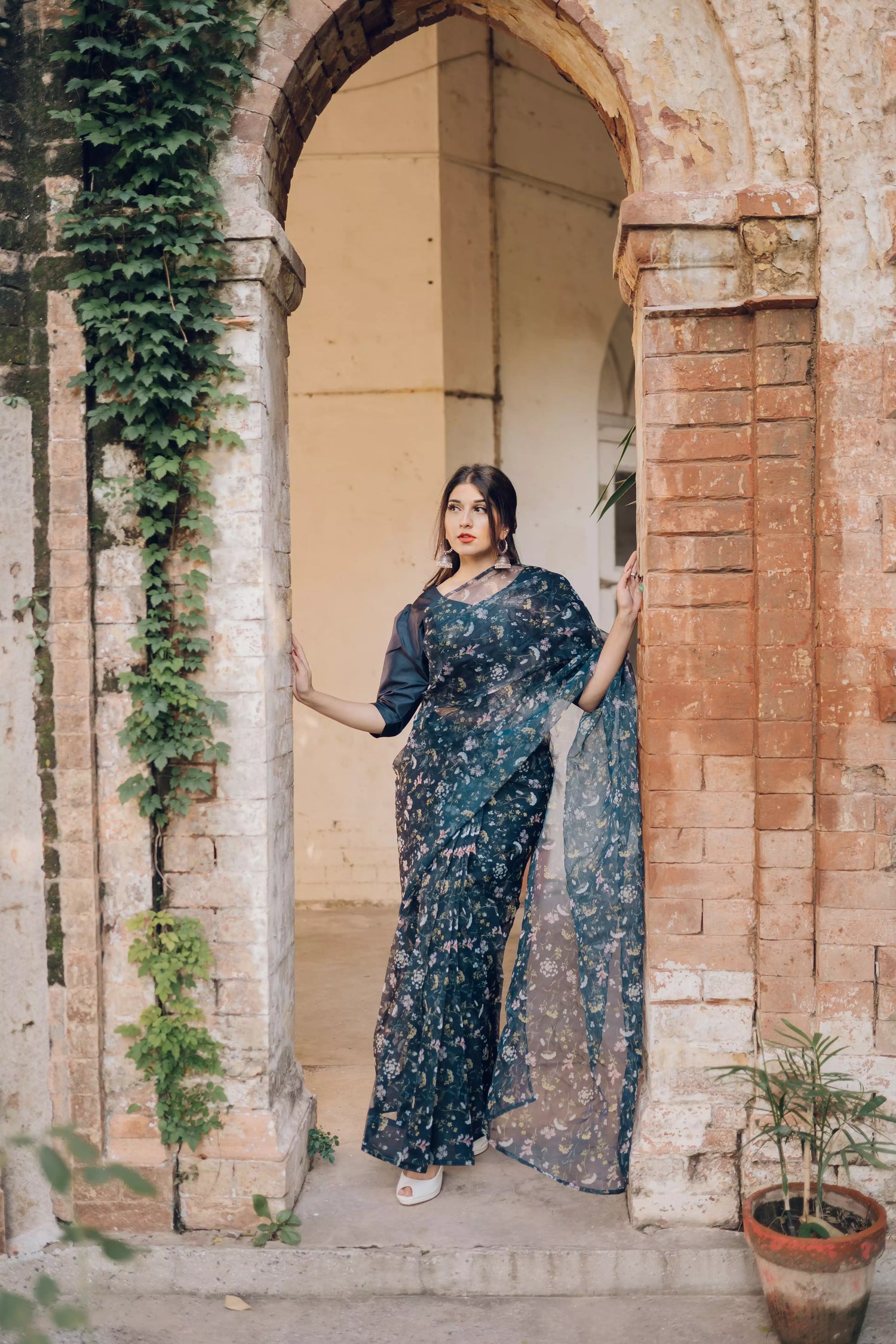 Floral navy blue saree styled gracefully with ethnic elegance.