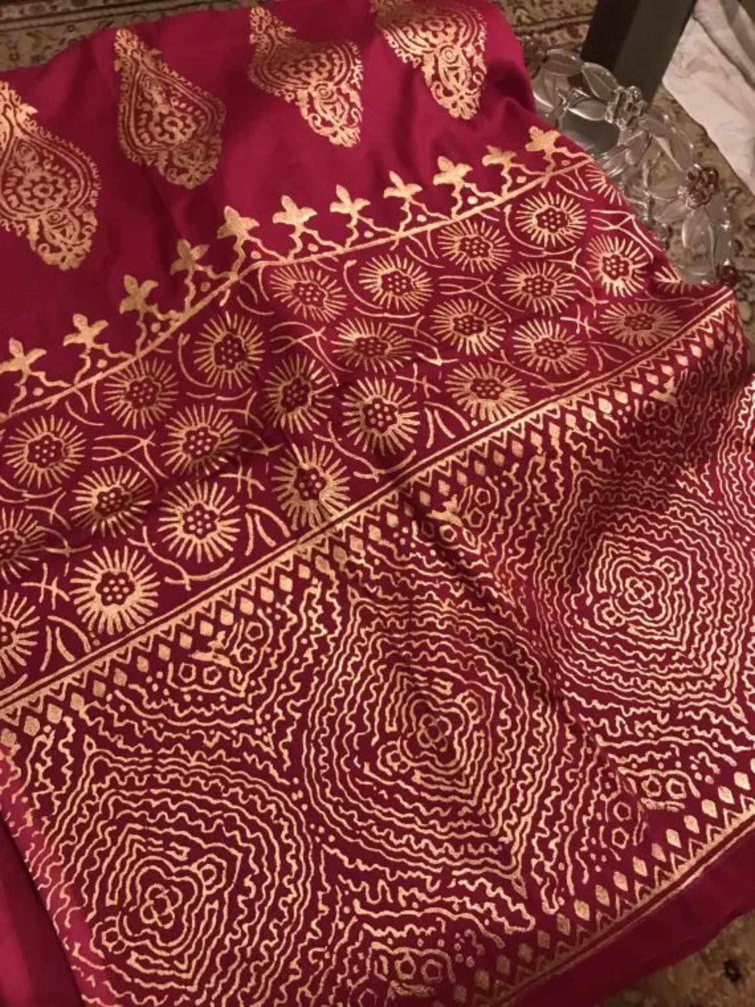 A navy blue shawl with golden block printed design adored with golden piko finishing exuding elegance and sophistication.