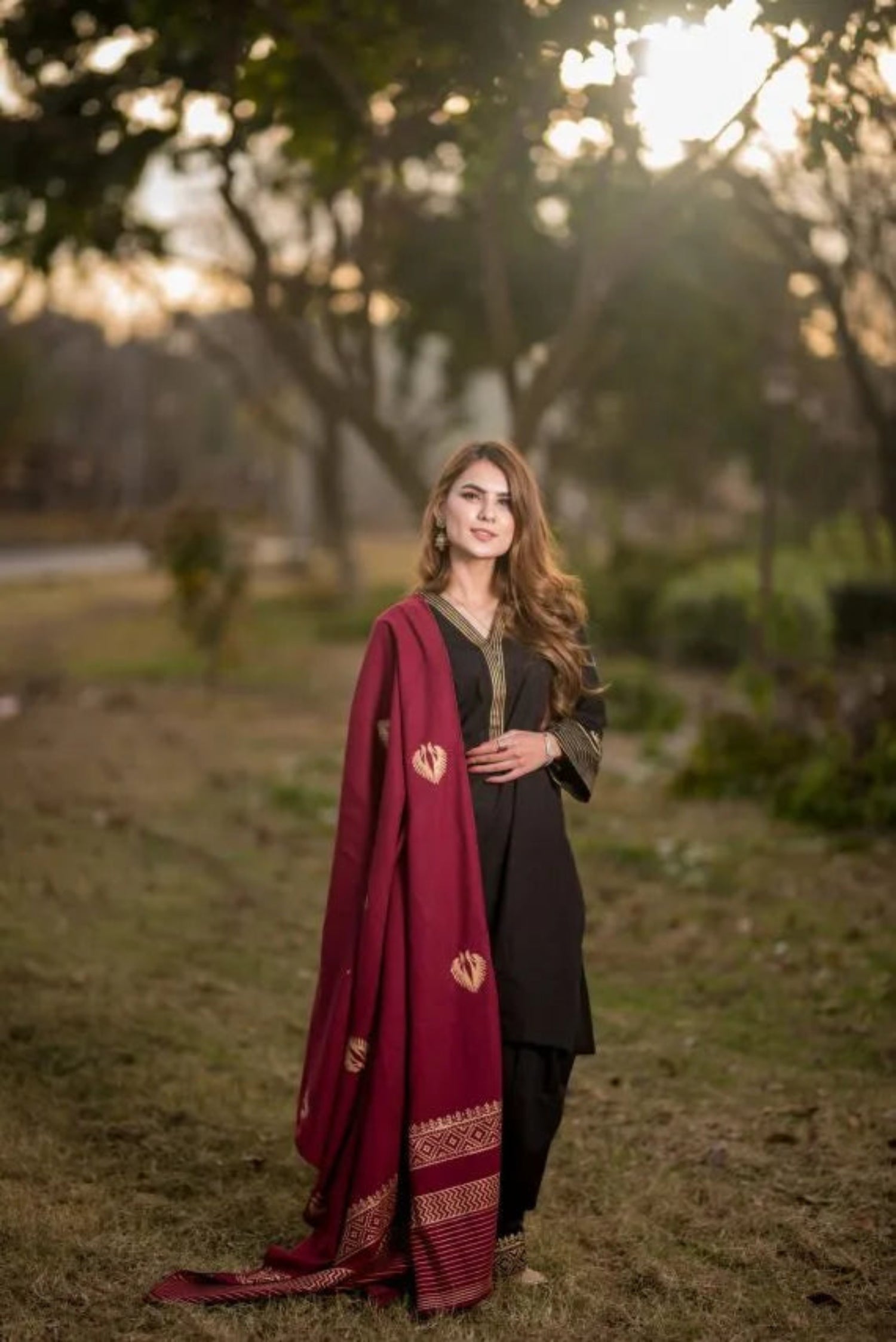A sophisticated Nakash Maroon Gold Shawl adored with block printed motifs and border, highlighting the elegant and unique look.