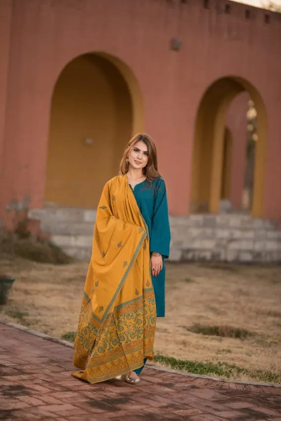 Elegant and trendy mustard swiss khaddar shawl adored with artisan block print patterns on the border as well as small motifs scattered throughout the shawl, perfect for casual and festive wear.
