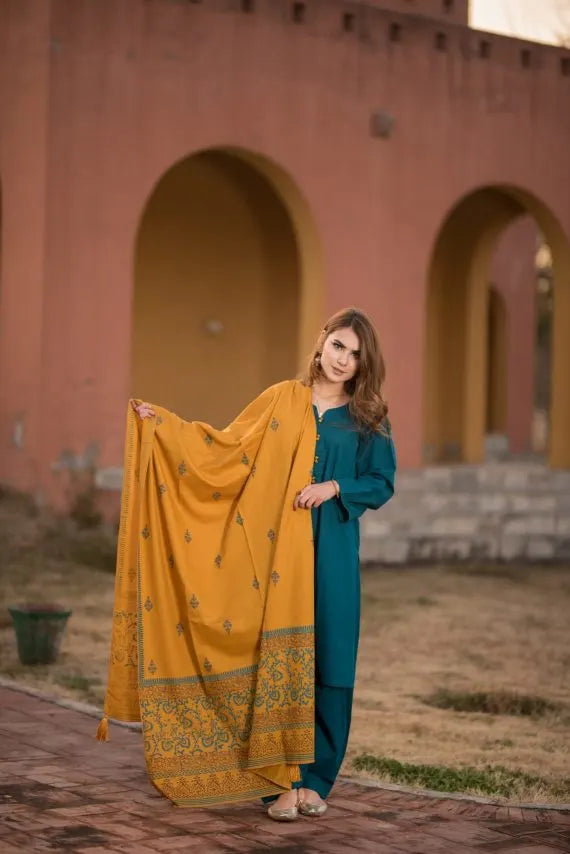 Elegant and trendy mustard swiss khaddar shawl adored with artisan block print patterns on the border as well as small motifs scattered throughout the shawl, perfect for casual and festive wear.