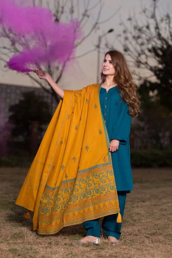 Elegant and trendy mustard swiss khaddar shawl adored with artisan block print patterns on the border as well as small motifs scattered throughout the shawl, perfect for casual and festive wear.