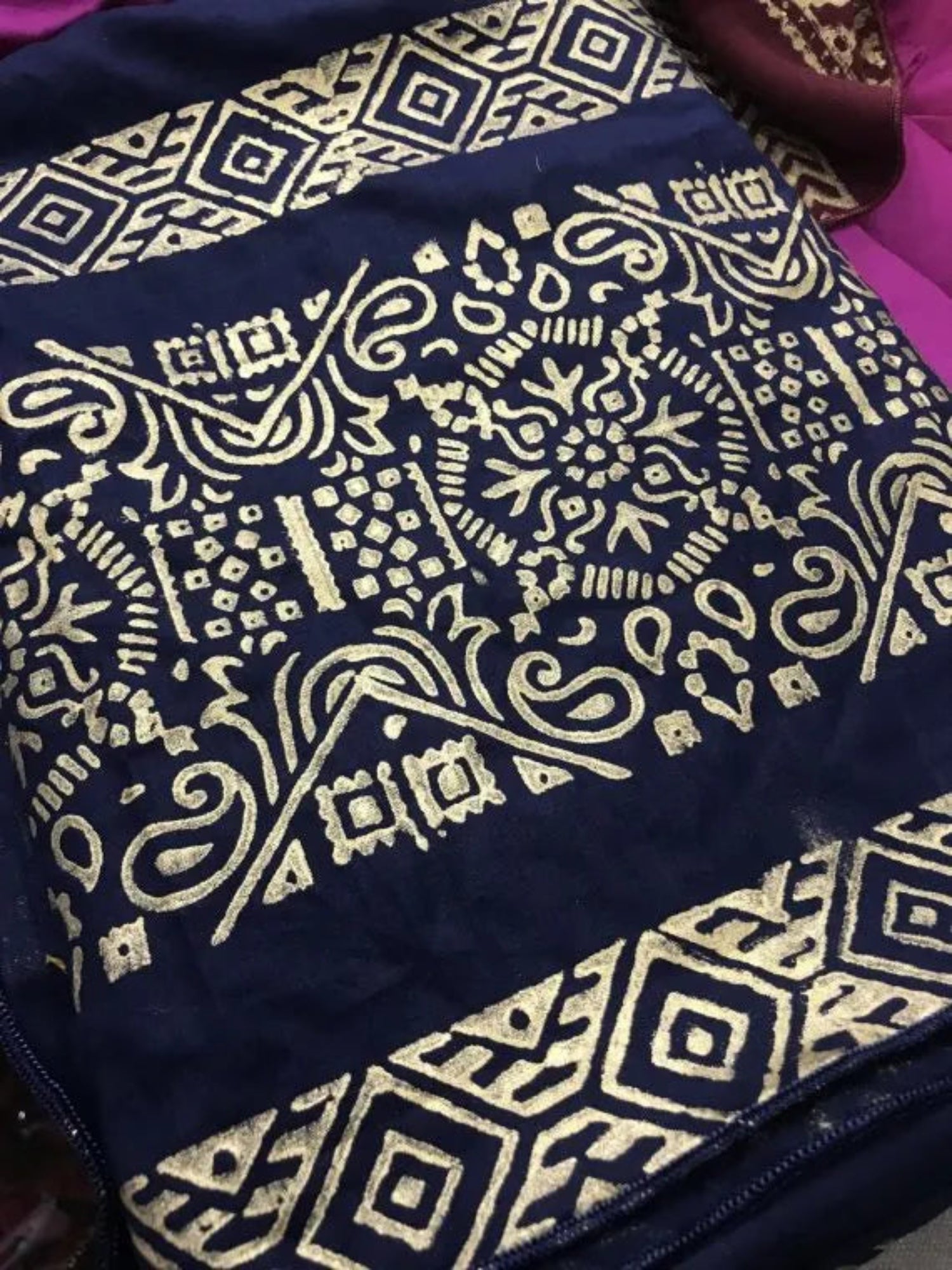 A luxurious shawl featuring geometric golden block printed design, adding a touch of regal charm and modern ensembles, ideal for every occasion.
