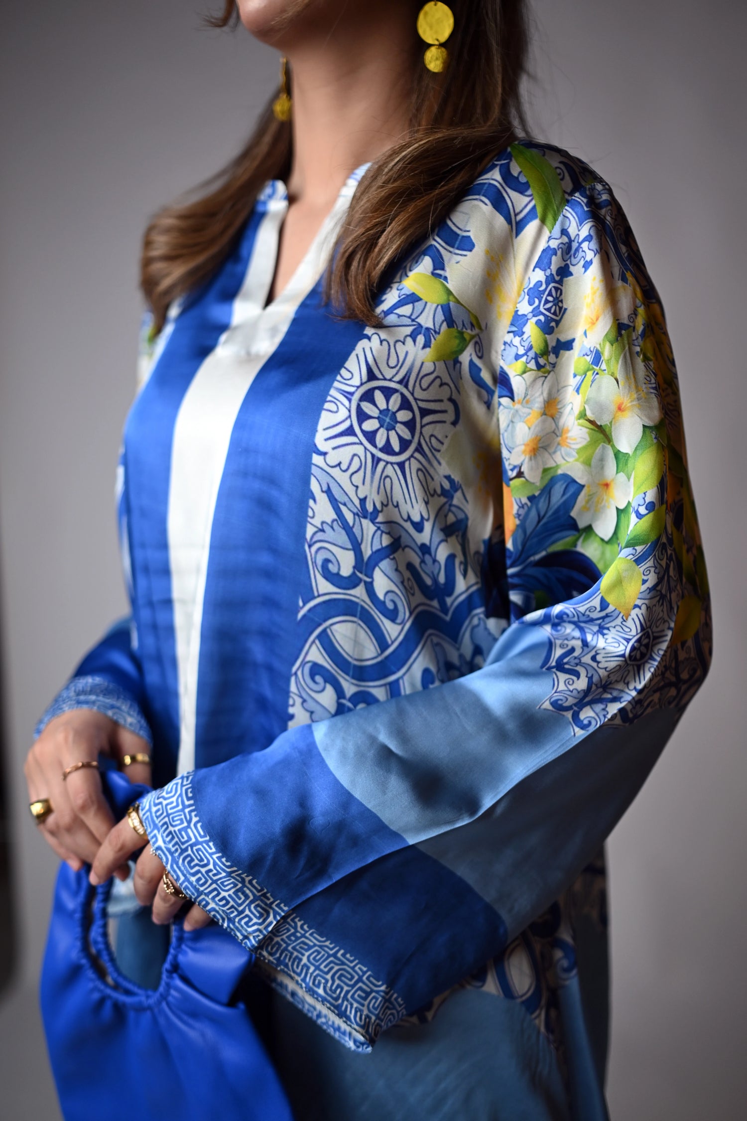 A blue and yellow cord set patterned pants, inspired by the sunny shores and vibrant colors of Santorini.