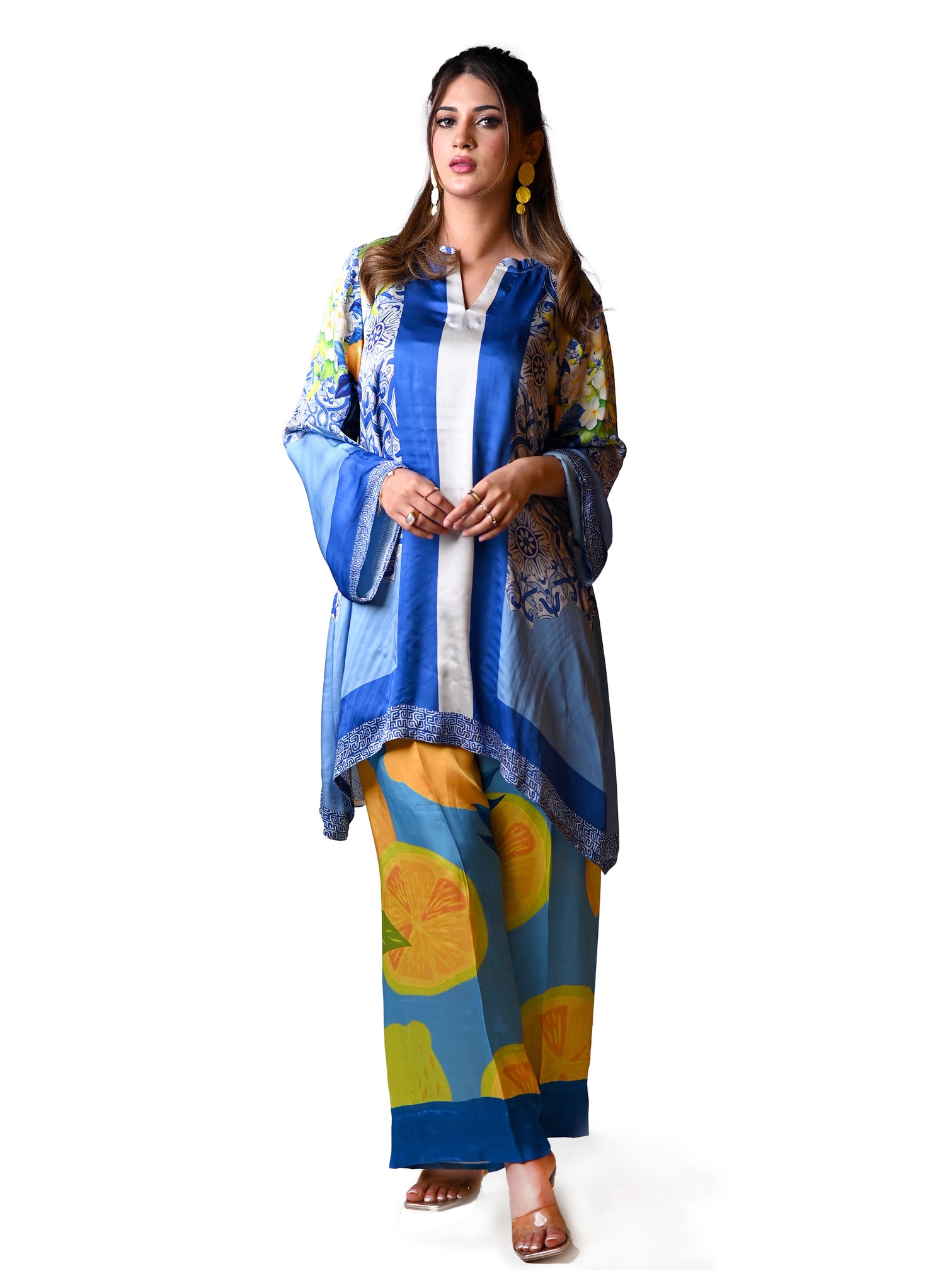 A blue and yellow cord set patterned pants, inspired by the sunny shores and vibrant colors of Santorini.