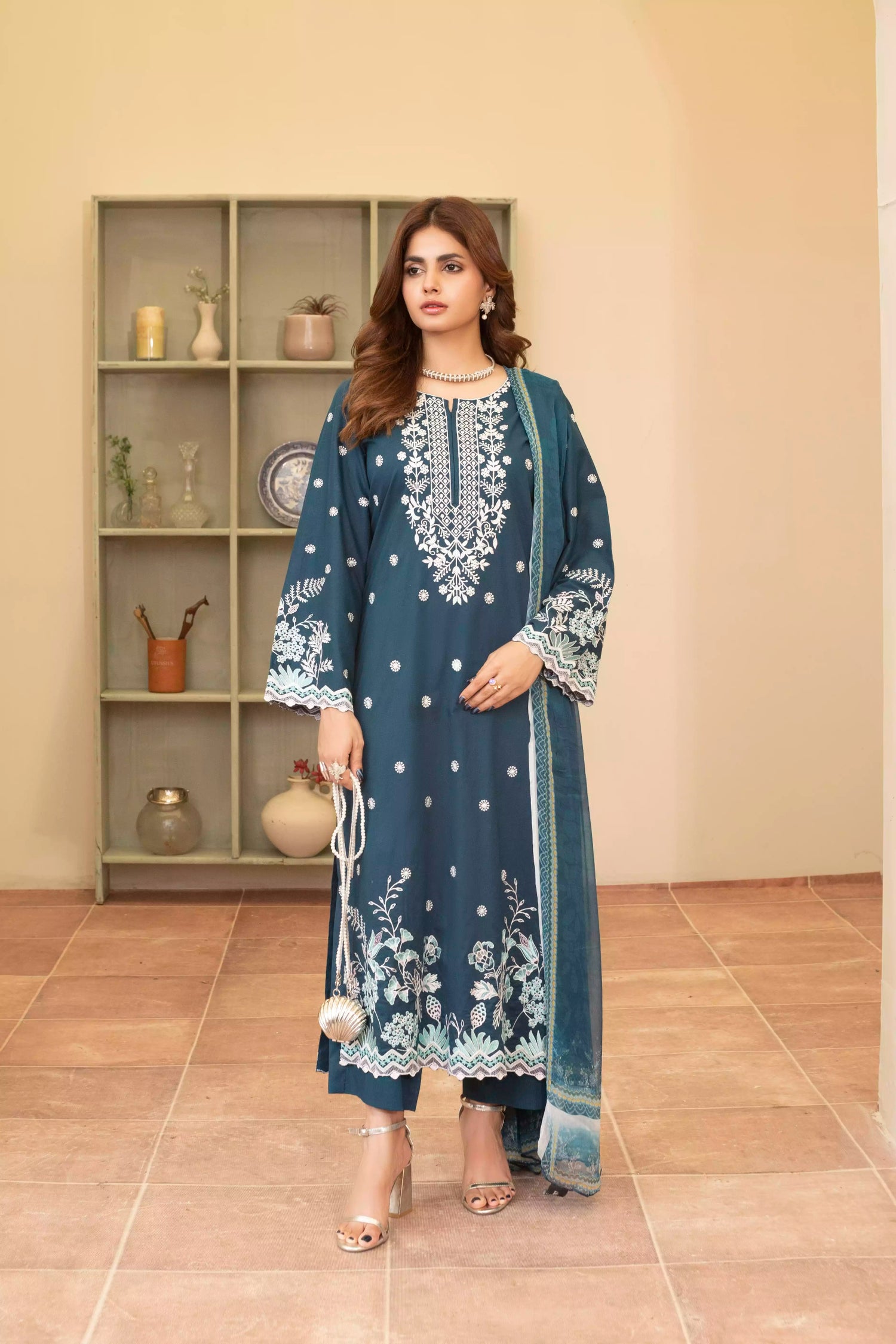Elegant zinc blue embroidered suit featuring detailed white motifs, complemented by a chiffon dupatta.