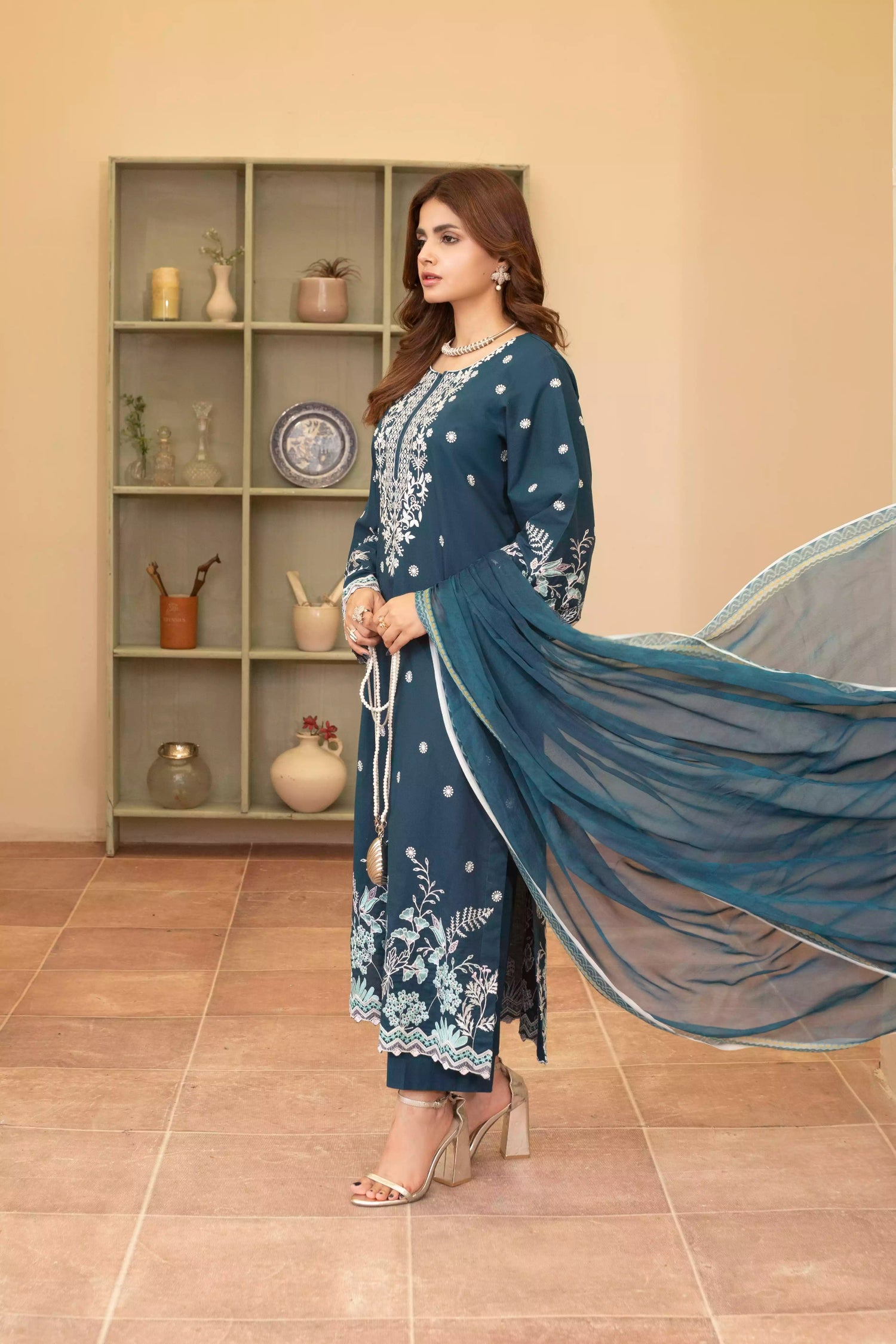 Elegant zinc blue embroidered suit featuring detailed white motifs, complemented by a chiffon dupatta.