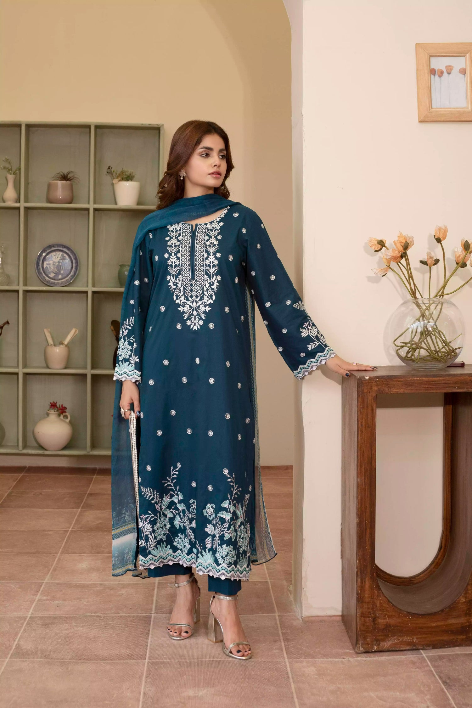 Elegant zinc blue embroidered suit featuring detailed white motifs, complemented by a chiffon dupatta.