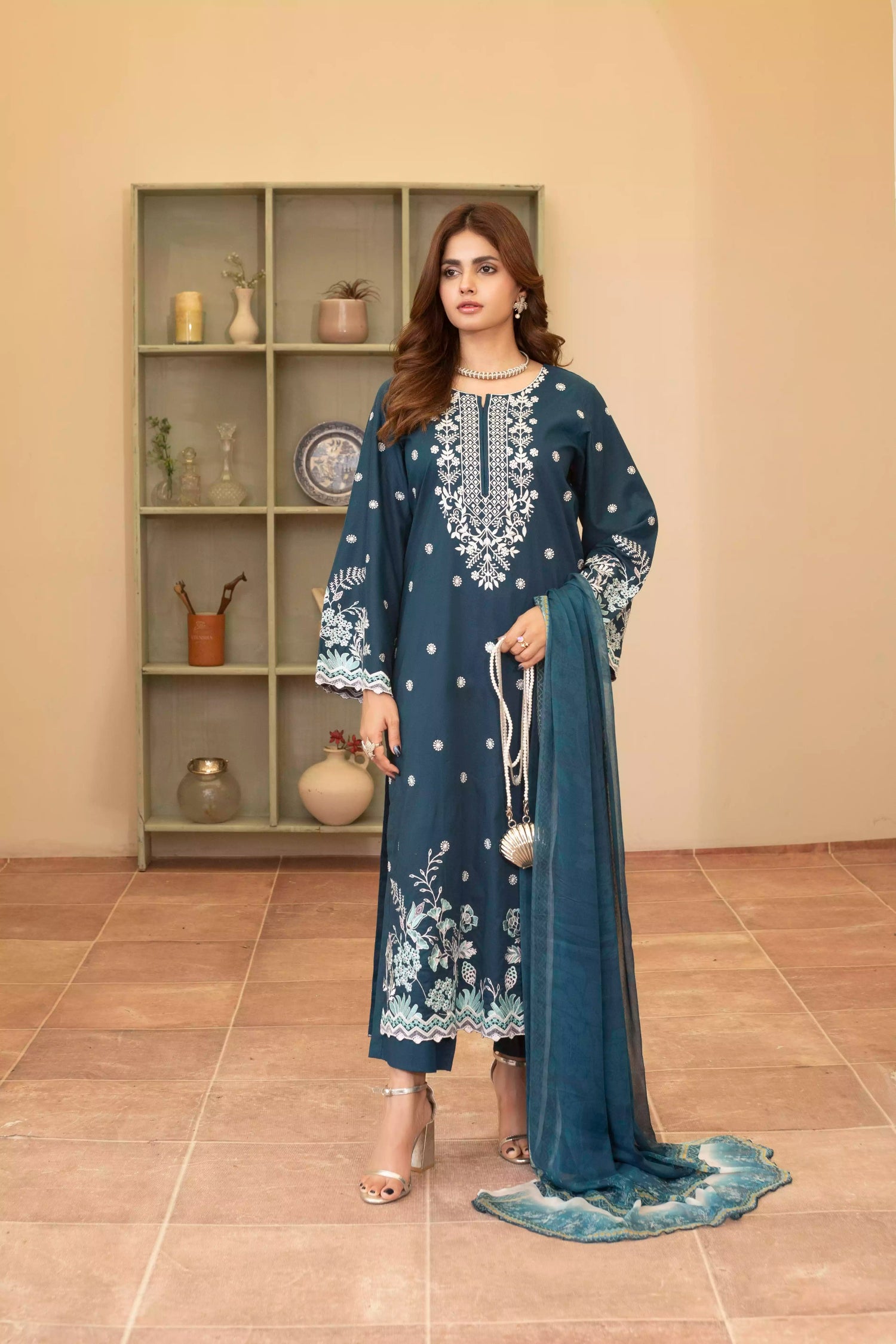 Elegant zinc blue embroidered suit featuring detailed white motifs, complemented by a chiffon dupatta.