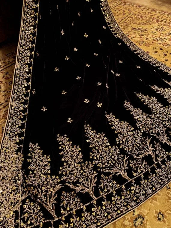 Black velvet shawl with intricate tila and sequin embroidery, featuring tree motif bunches on the pallu and four-sided embroidered borders, finished with a luxurious Jamawar palta.