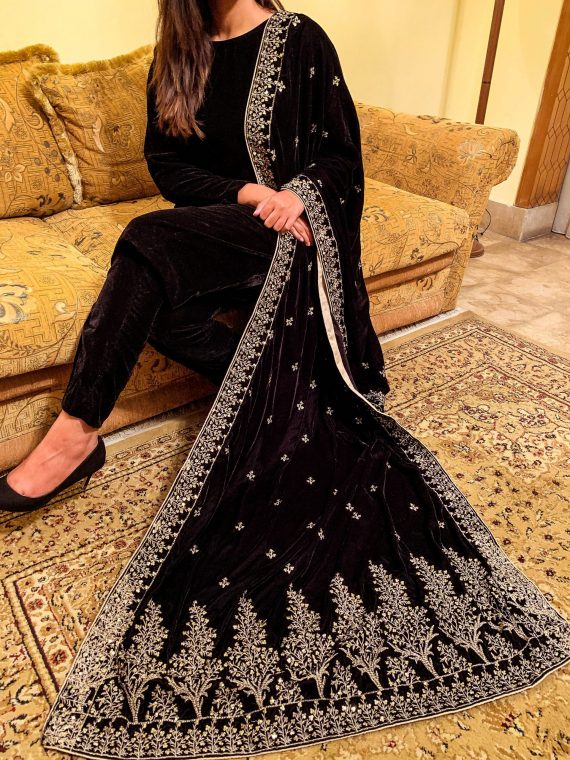 Black velvet shawl with intricate tila and sequin embroidery, featuring tree motif bunches on the pallu and four-sided embroidered borders, finished with a luxurious Jamawar palta.