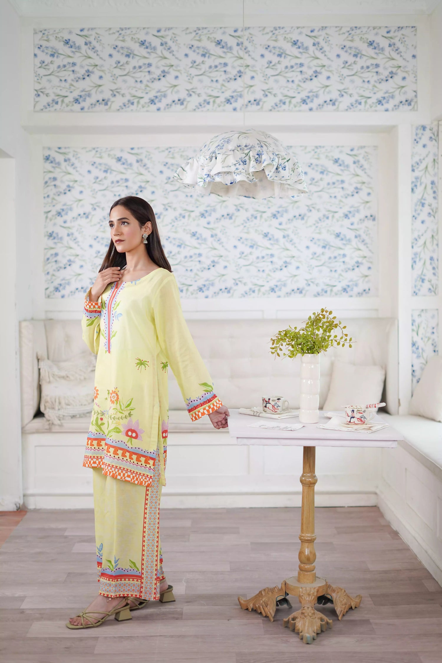 A pastel yellow digital-printed 2 piece suit adorned with calming blues, delicate florals. A perfect blend of simplicity and charm.