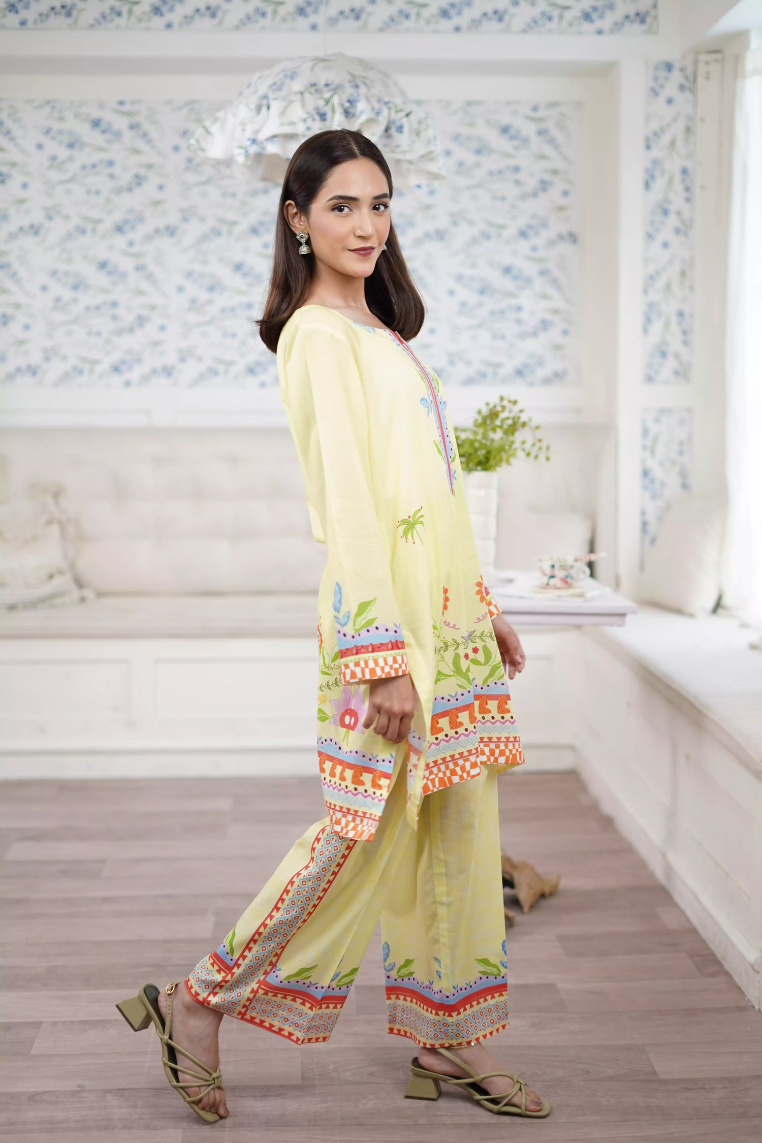A pastel yellow digital-printed 2 piece suit adorned with calming blues, delicate florals. A perfect blend of simplicity and charm.
