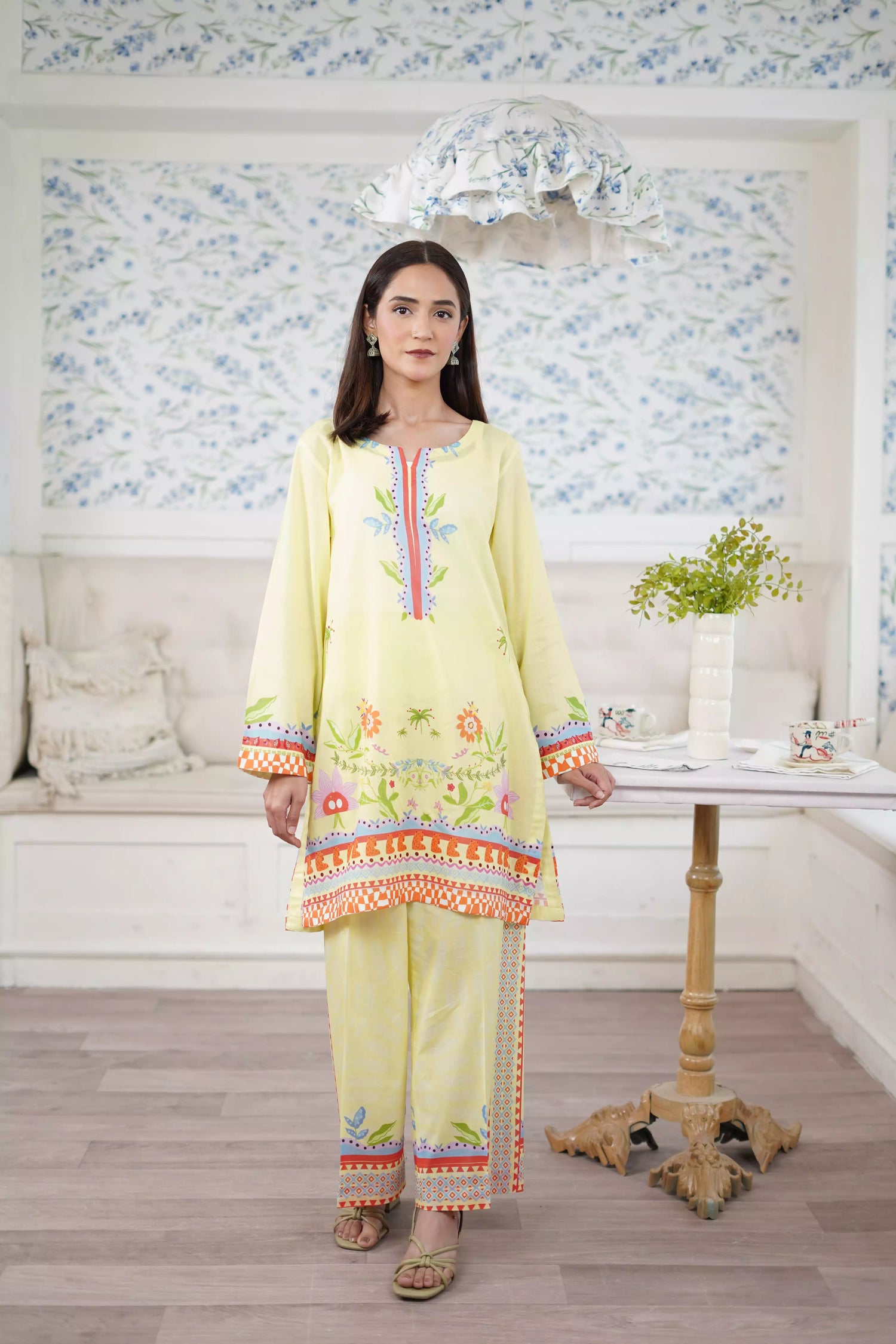 A pastel yellow digital-printed 2 piece suit adorned with calming blues, delicate florals. A perfect blend of simplicity and charm.