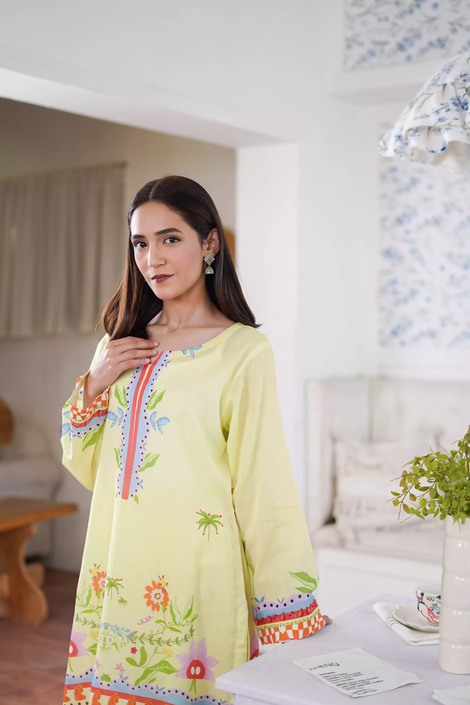 A pastel yellow digital-printed 2 piece suit adorned with calming blues, delicate florals. A perfect blend of simplicity and charm.