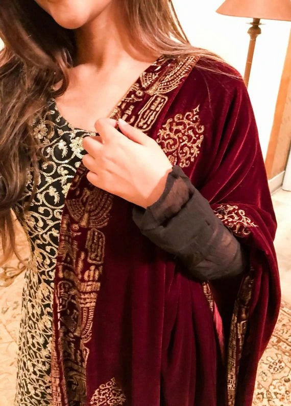 Elegant maroon shawl adorned with intricate gold embroidery, showcasing Mughal artistry and ideal for festive events.