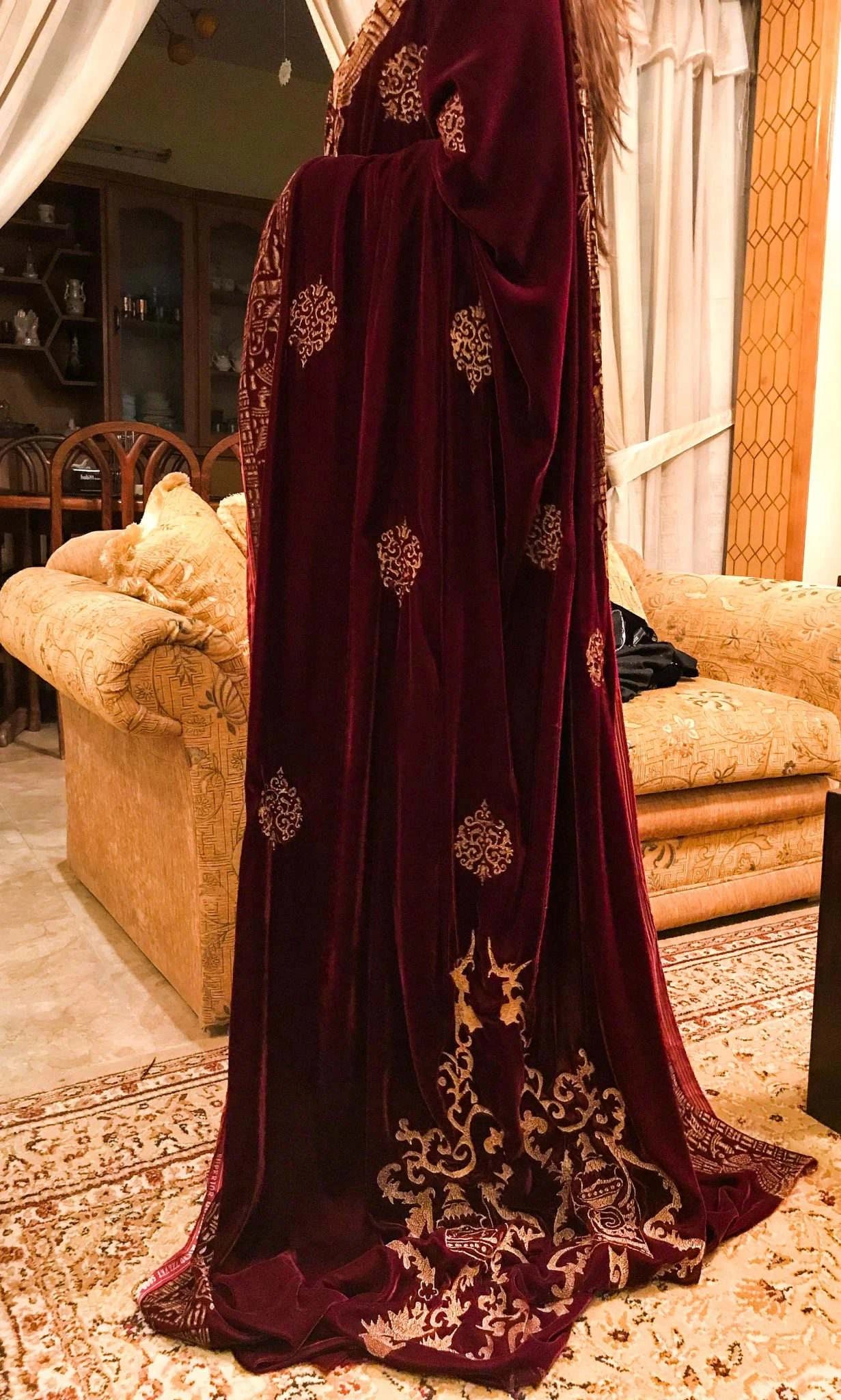 Elegant maroon shawl adorned with intricate gold embroidery, showcasing Mughal artistry and ideal for festive events.