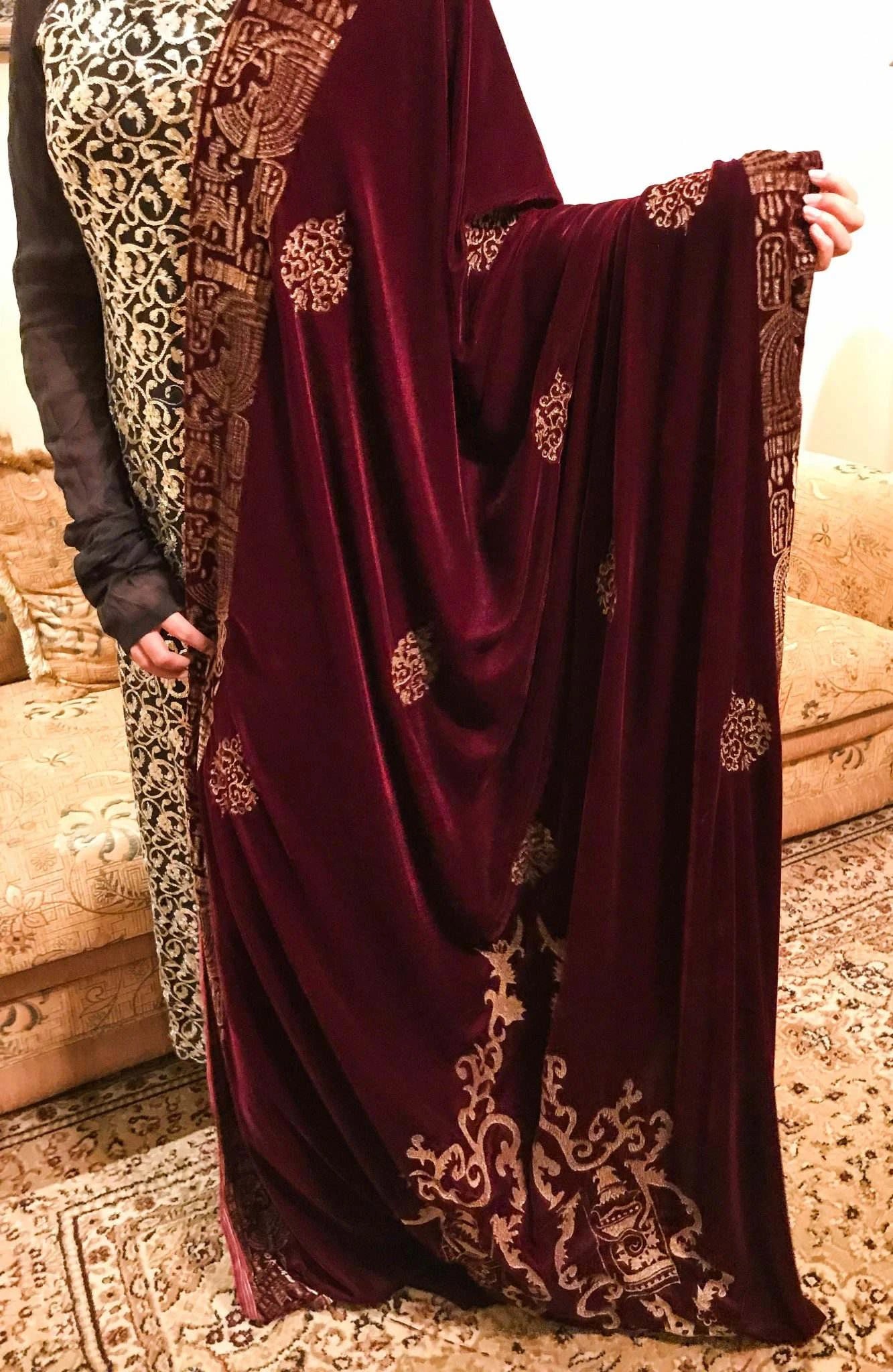 Elegant maroon shawl adorned with intricate gold embroidery, showcasing Mughal artistry and ideal for festive events.