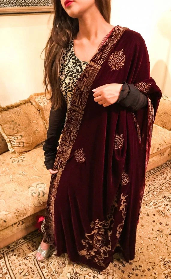 Elegant maroon shawl adorned with intricate gold embroidery, showcasing Mughal artistry and ideal for festive events.