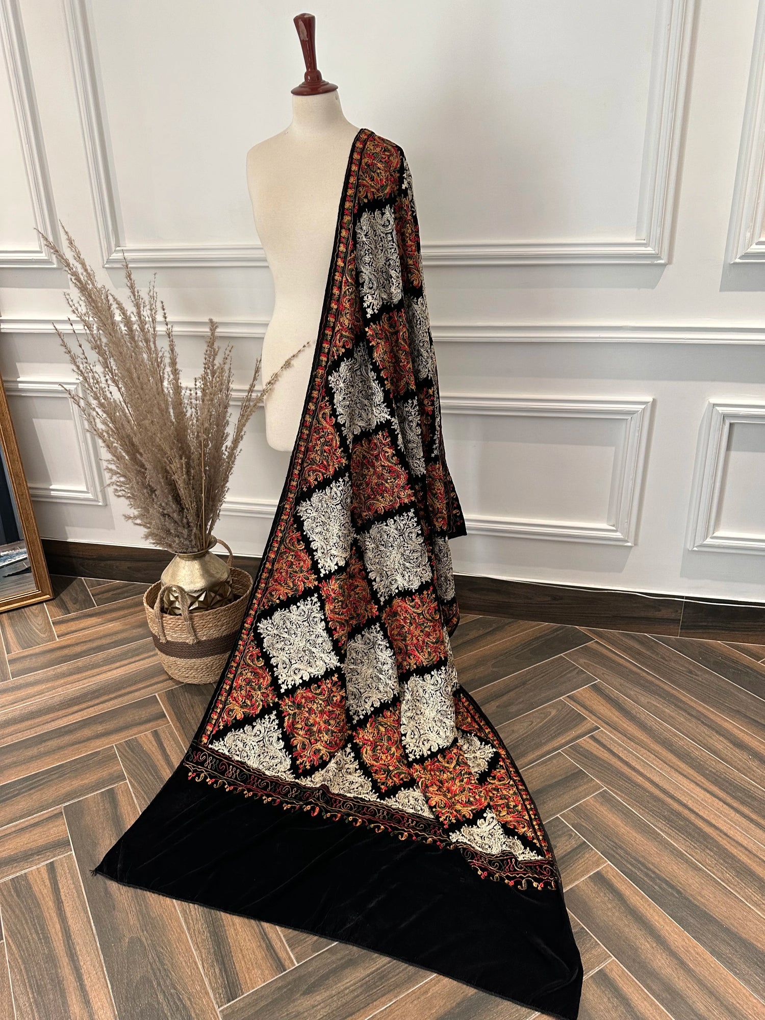 A black velvet shawl adored with multi-thread embroidery, highlighting chic modern style and fashionable aesthetic.