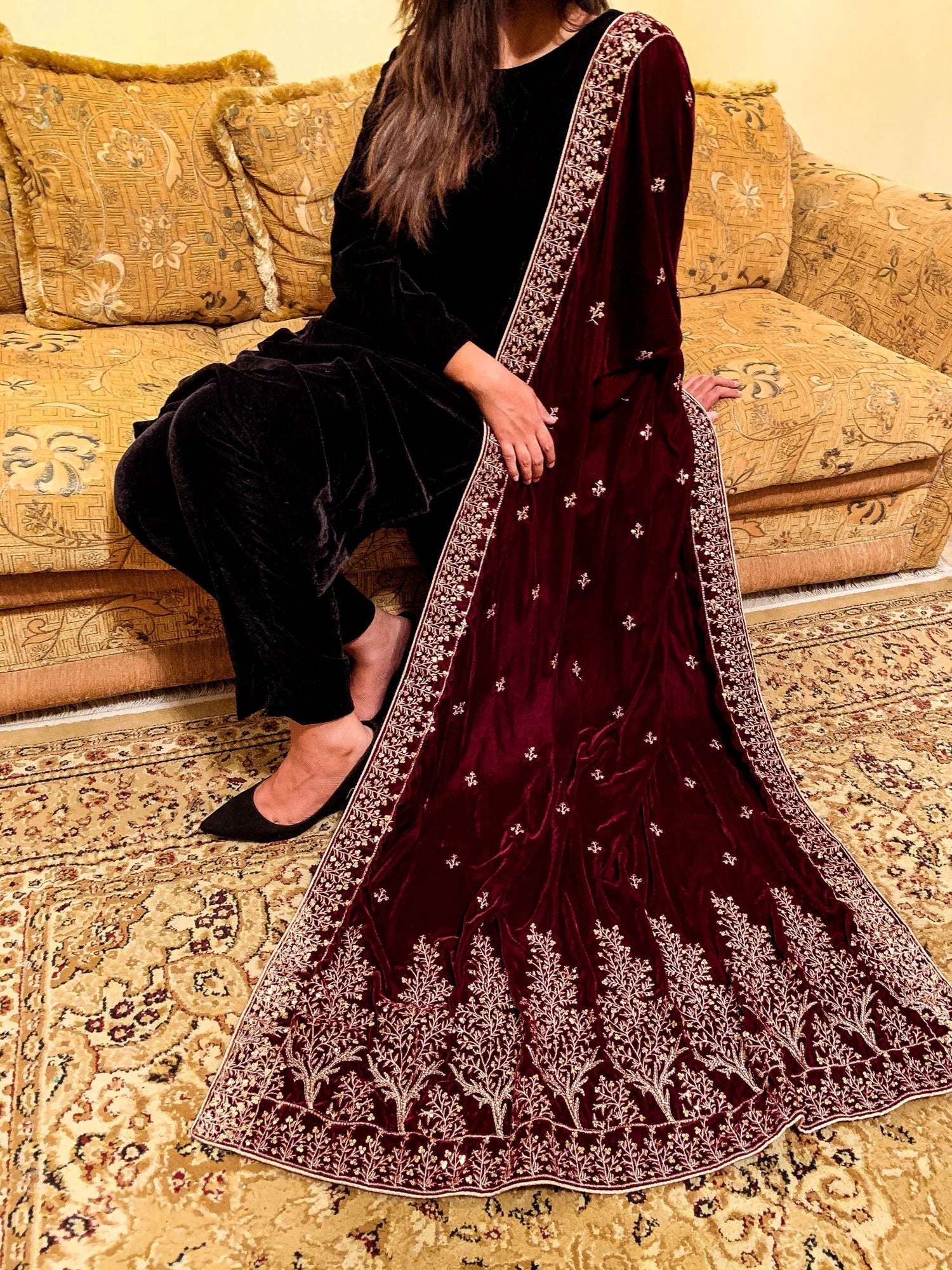 Luxurious velvet shawl featuring intricate tila and sequin embroidery with tree motifs on palu, detailed borders on all sides, and finished with a rich jamawar palta