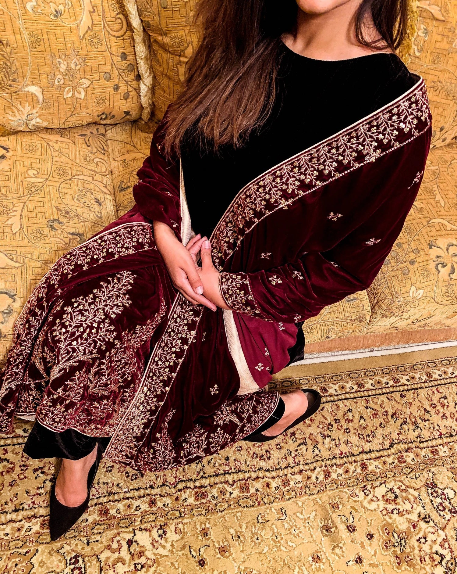 Luxurious velvet shawl featuring intricate tila and sequin embroidery with tree motifs on palu, detailed borders on all sides, and finished with a rich jamawar palta