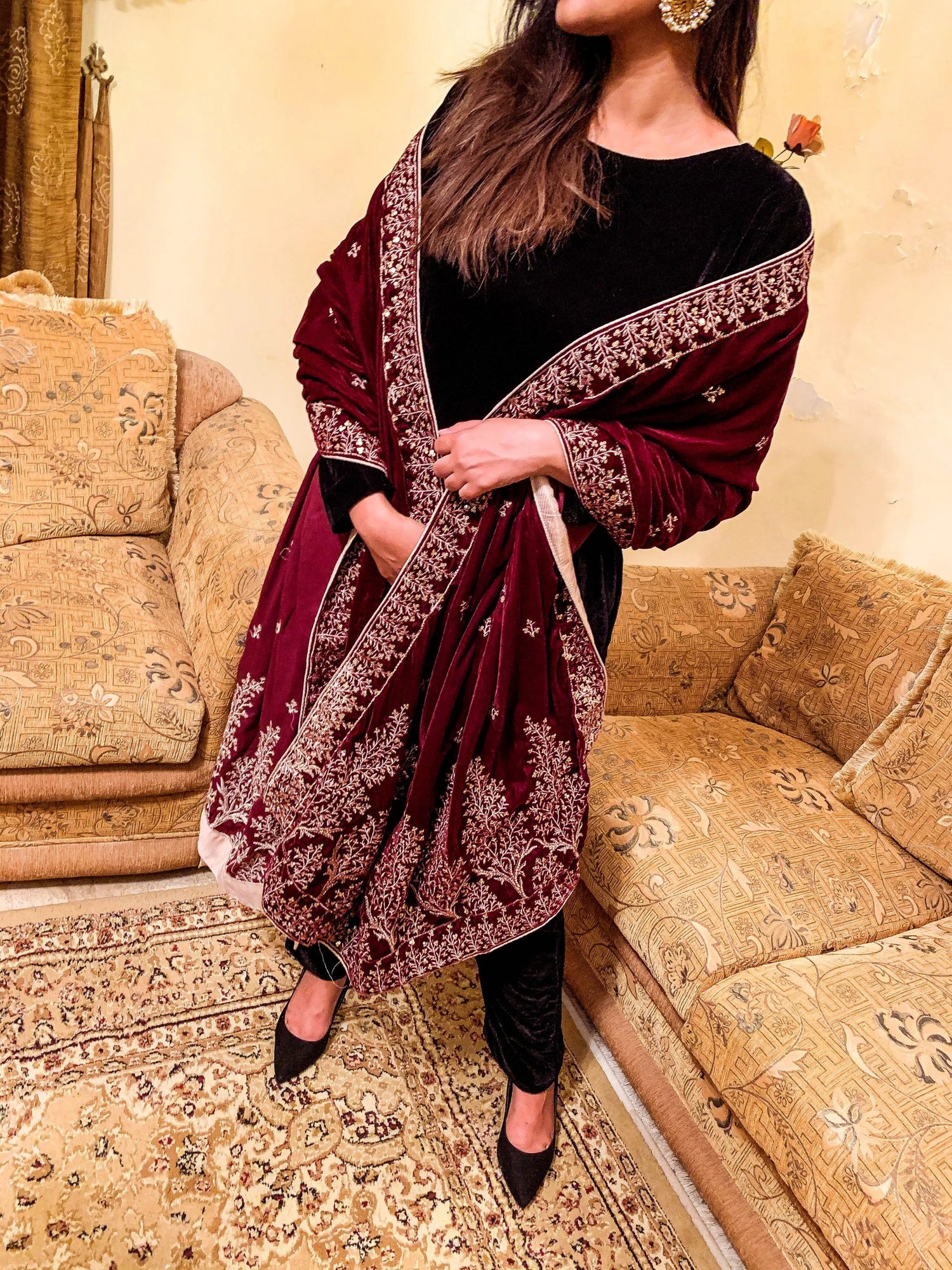 Luxurious velvet shawl featuring intricate tila and sequin embroidery with tree motifs on palu, detailed borders on all sides, and finished with a rich jamawar palta