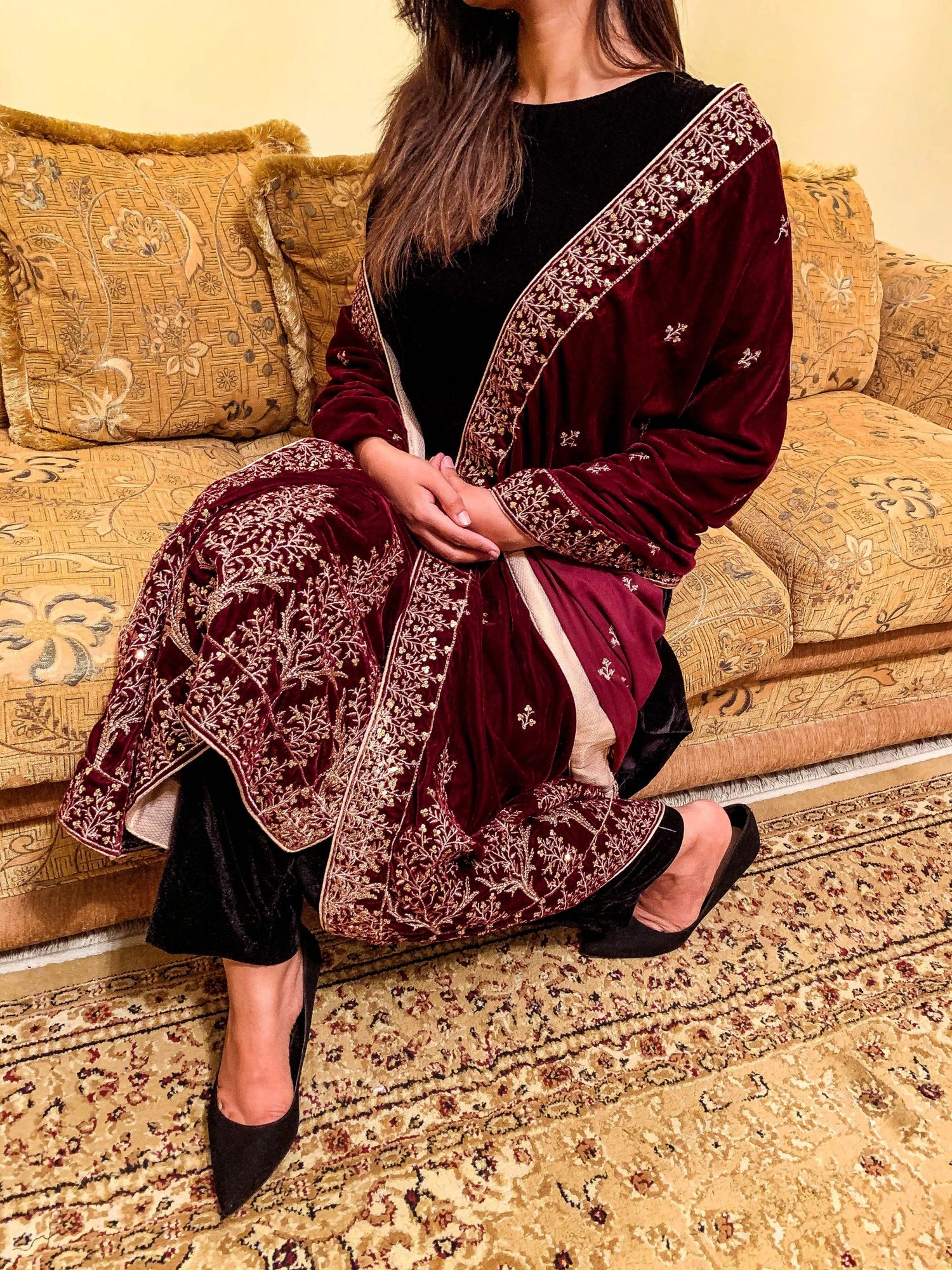 Luxurious velvet shawl featuring intricate tila and sequin embroidery with tree motifs on palu, detailed borders on all sides, and finished with a rich jamawar palta