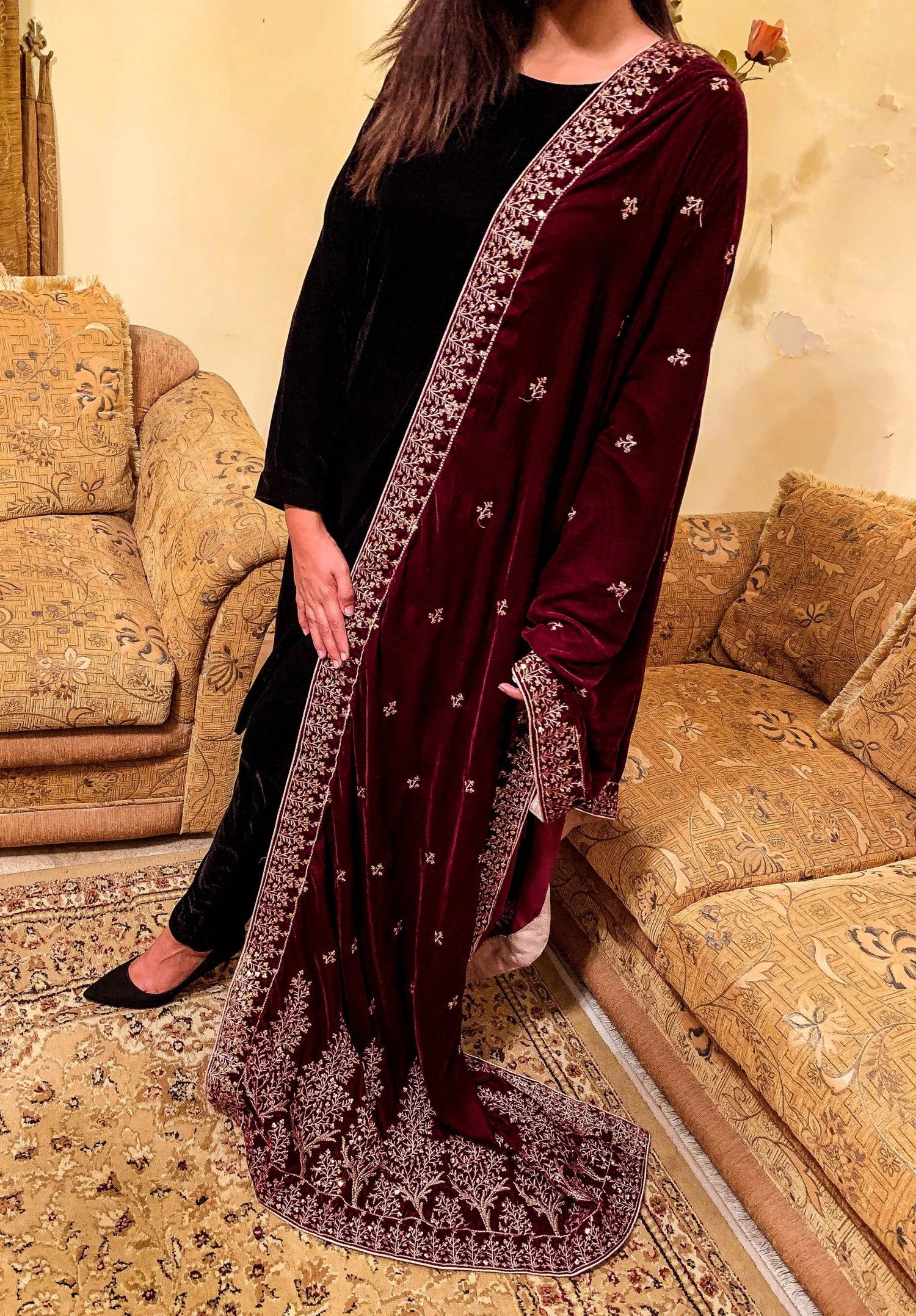 Luxurious velvet shawl featuring intricate tila and sequin embroidery with tree motifs on palu, detailed borders on all sides, and finished with a rich jamawar palta