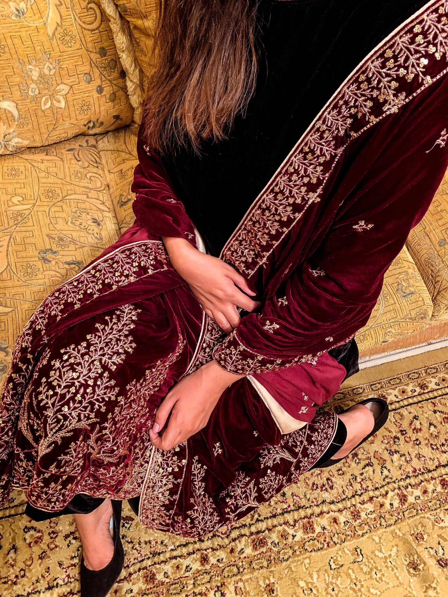 Luxurious velvet shawl featuring intricate tila and sequin embroidery with tree motifs on palu, detailed borders on all sides, and finished with a rich jamawar palta