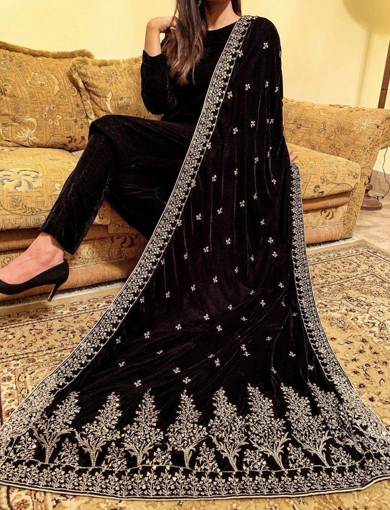 Luxurious velvet shawl featuring intricate tila and sequin embroidery with tree motifs on palu, detailed borders on all sides, and finished with a rich jamawar palta