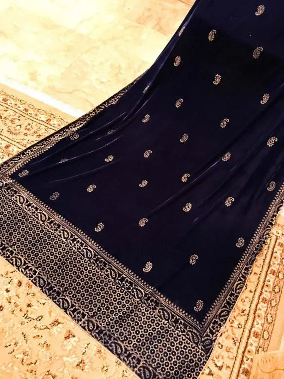 Luxurious velvet shawl detailed with gold block and screen printed designs. Showing a graceful fusion of heritage artistry and elegance.
