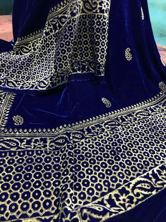 Luxurious velvet shawl detailed with gold block and screen printed designs. Showing a graceful fusion of heritage artistry and elegance.