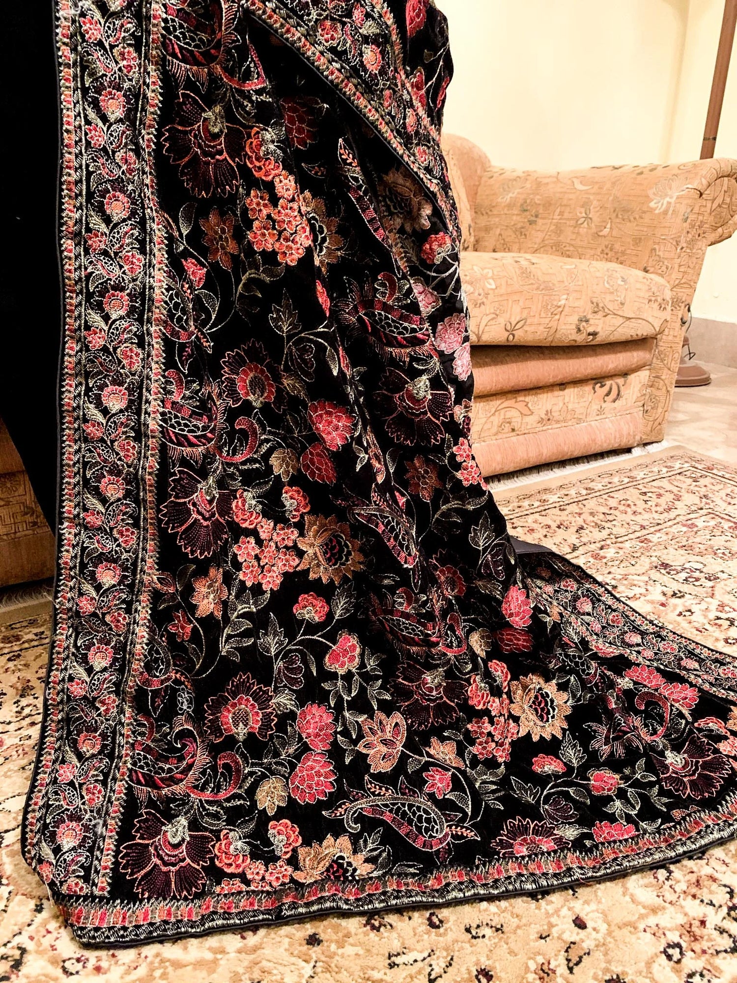 Elegant black and red floral shawl, featuring tila embroidery finished with silk piping, highlighting intricate craftsmanship and luxurious appeal.