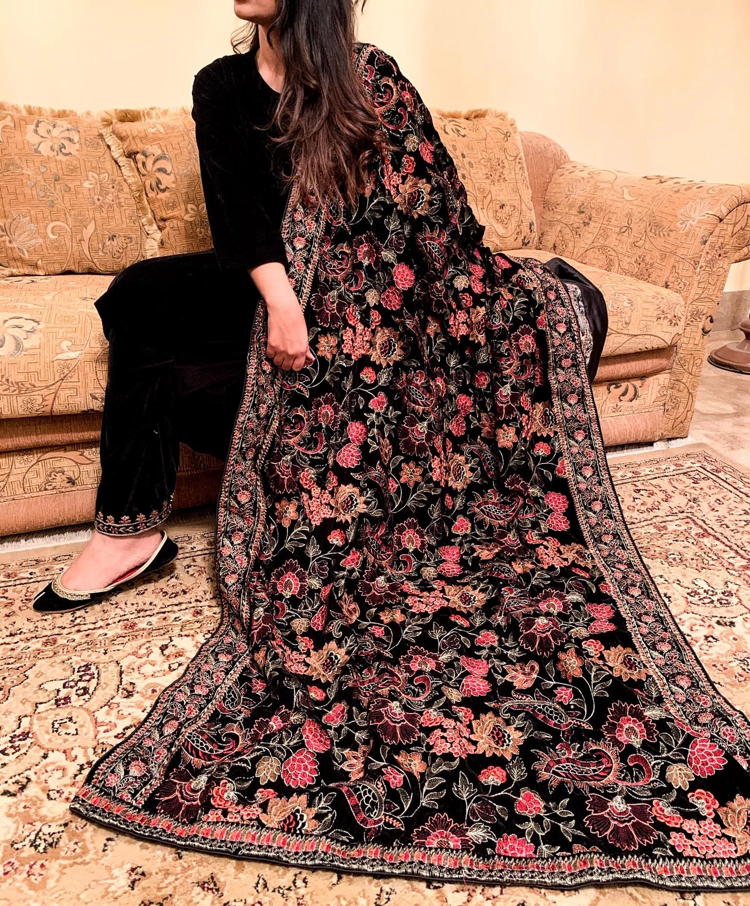 Elegant black and red floral shawl, featuring tila embroidery finished with silk piping, highlighting intricate craftsmanship and luxurious appeal.