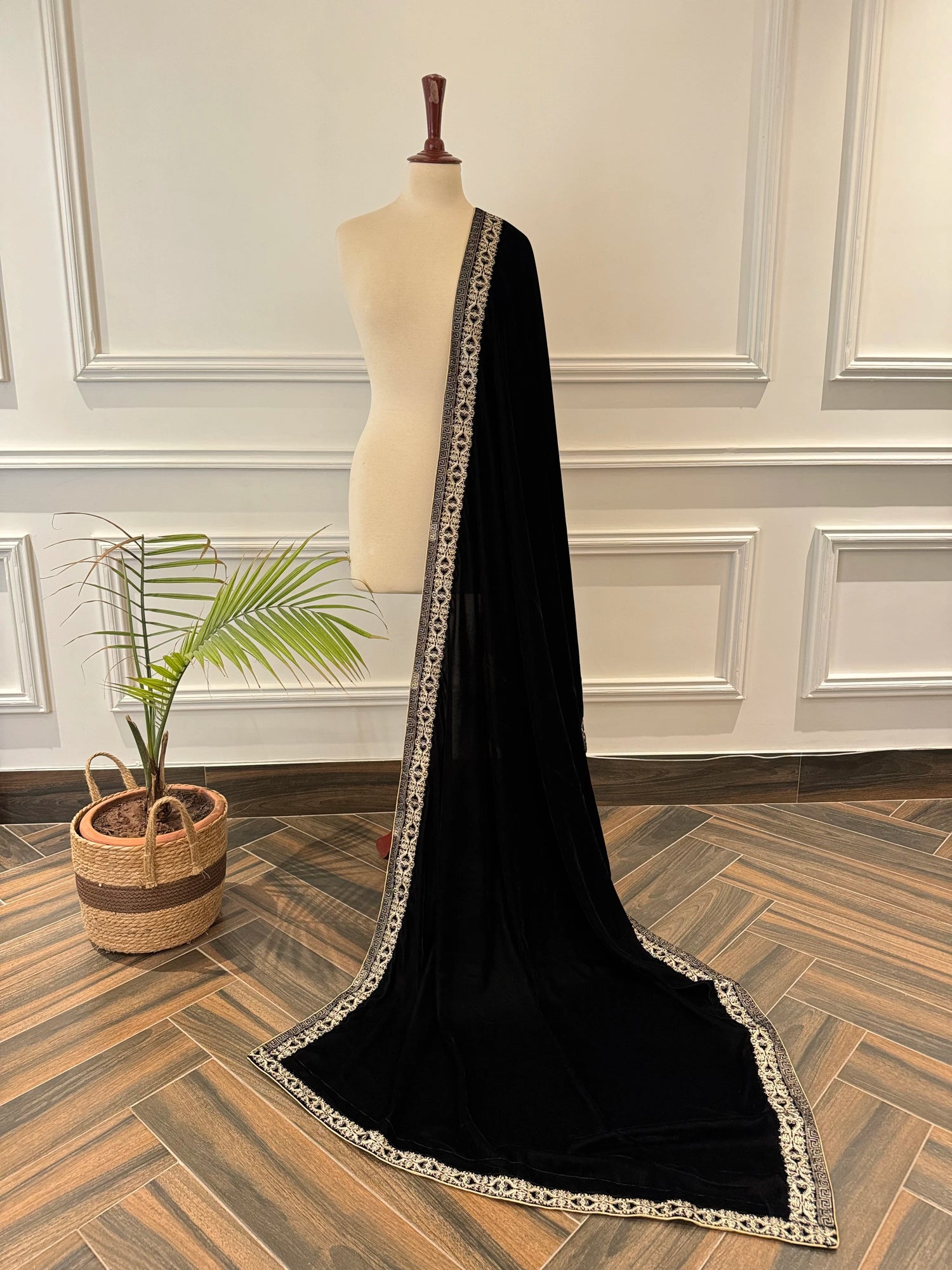 Elegant black velvet shawl featuring detailed tila embroidery on border, perfect for formal events and festive gatherings.