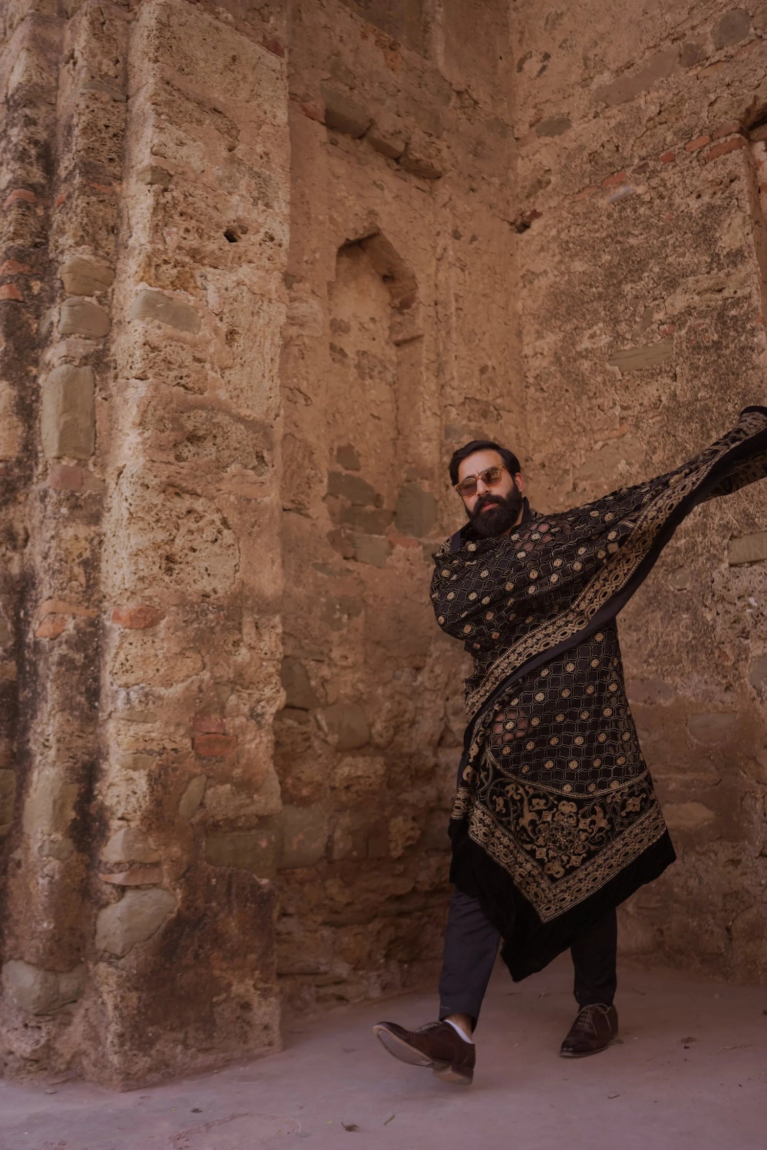 Luxurious black velvet shawl adored with detailed cut work and laser embroidery, perfect for formal and festive wear.