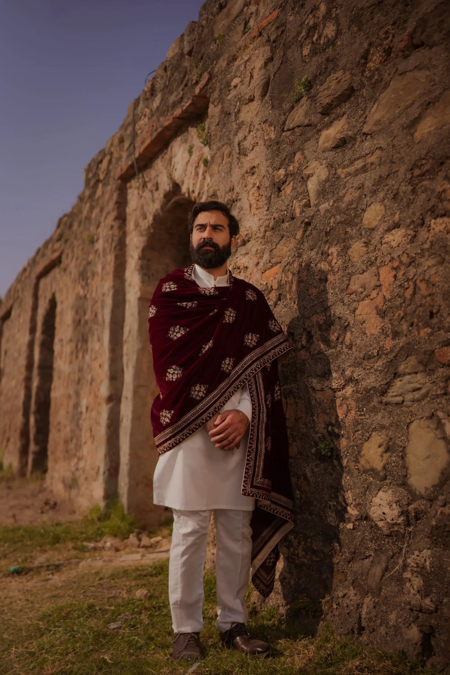 Elevate your style with luxurious velvet shawl adored with delicate thread embroidery, four-side borders, and small golden motifs throughout, unisex festive and formal wear.