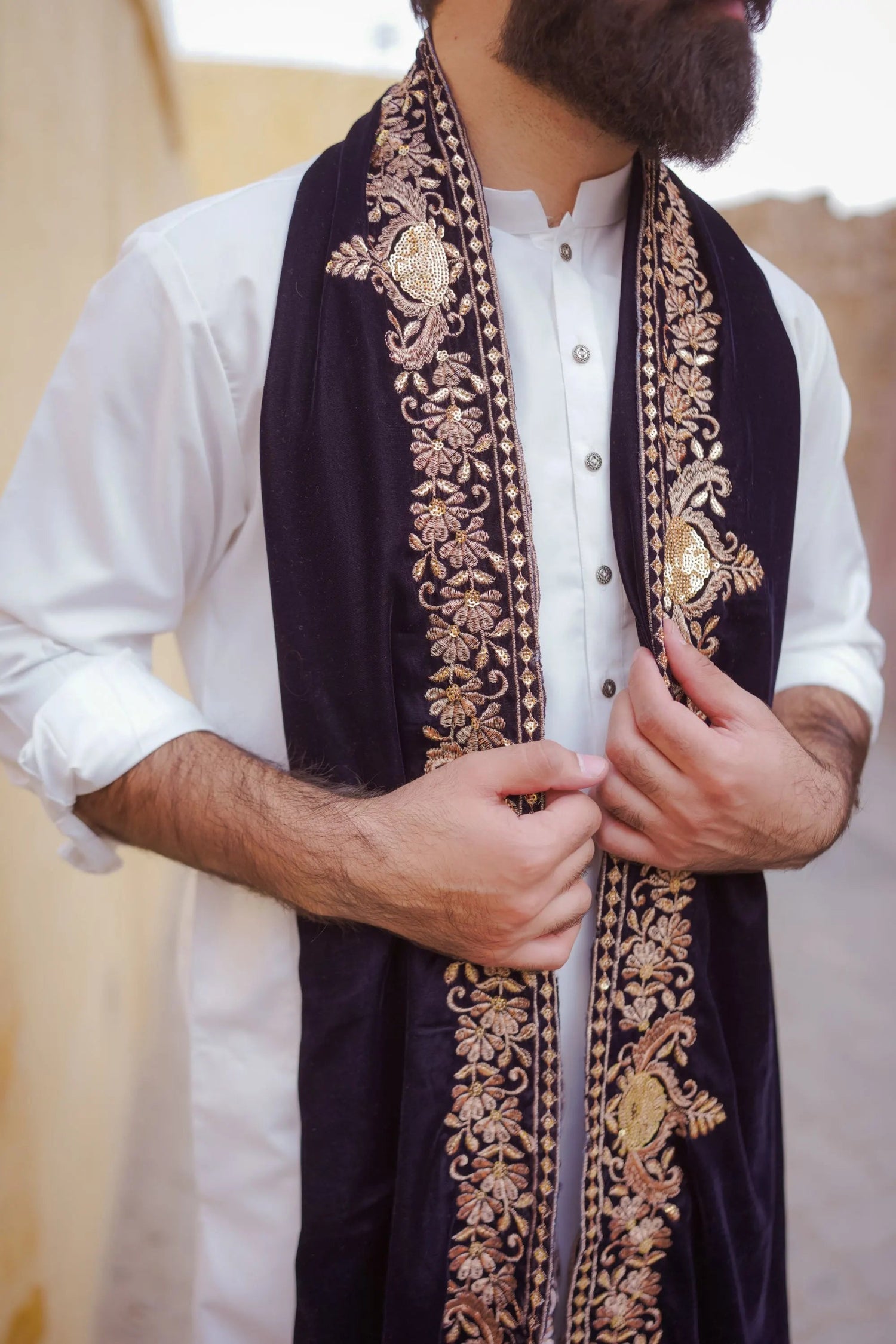 Discover the regal velvet shawl, adored with intricate tila embroidery and shimmering sequins, luxurious, elegant, and versatile look.