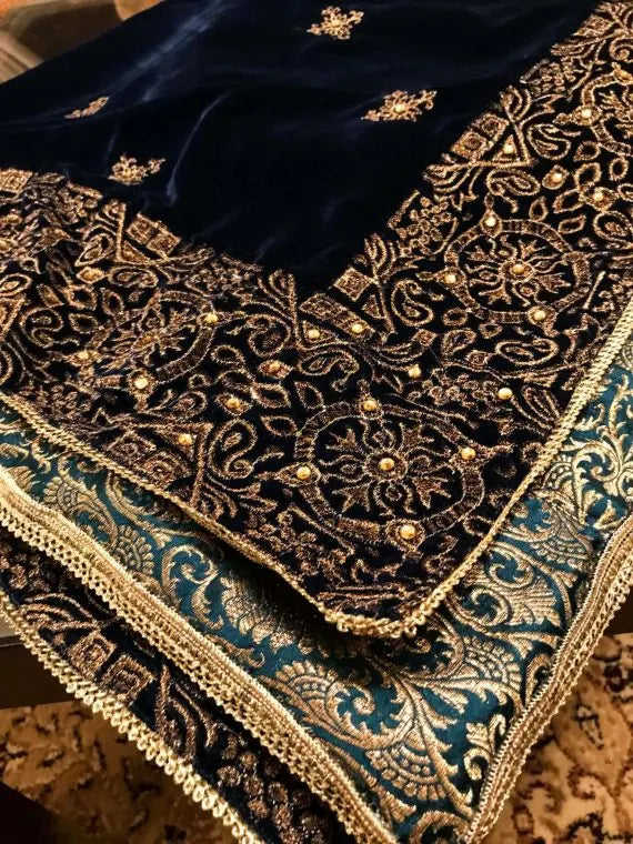 Beautifully crafted velvet shawl featuring intricate gold tila embroidery complemented with chata work and a Banarsi border exuding sophistication, perfect for formal events.