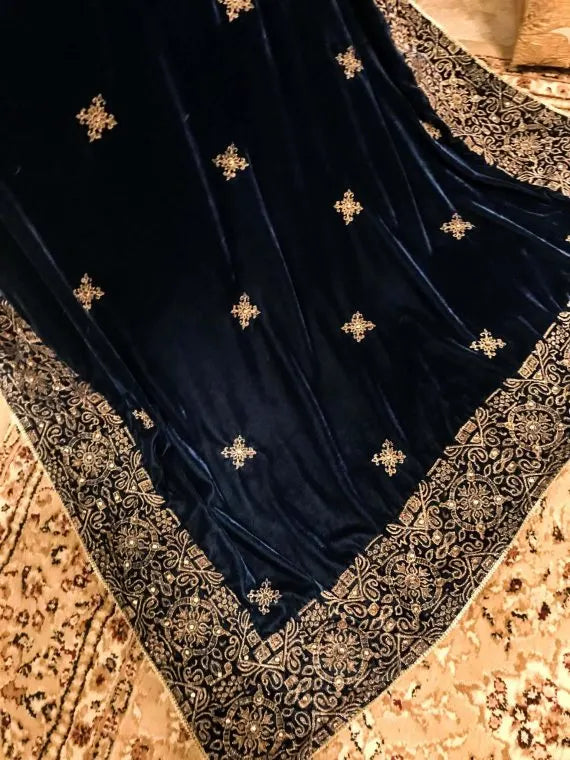 Beautifully crafted velvet shawl featuring intricate gold tila embroidery complemented with chata work and a Banarsi border exuding sophistication, perfect for formal events.